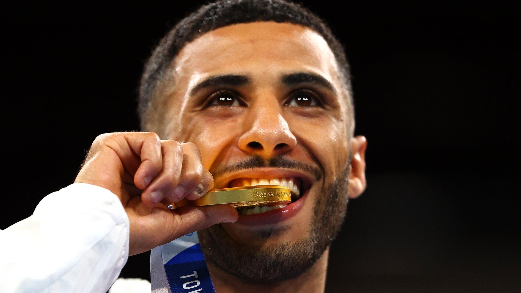 Galal Yafai biting his gold medal