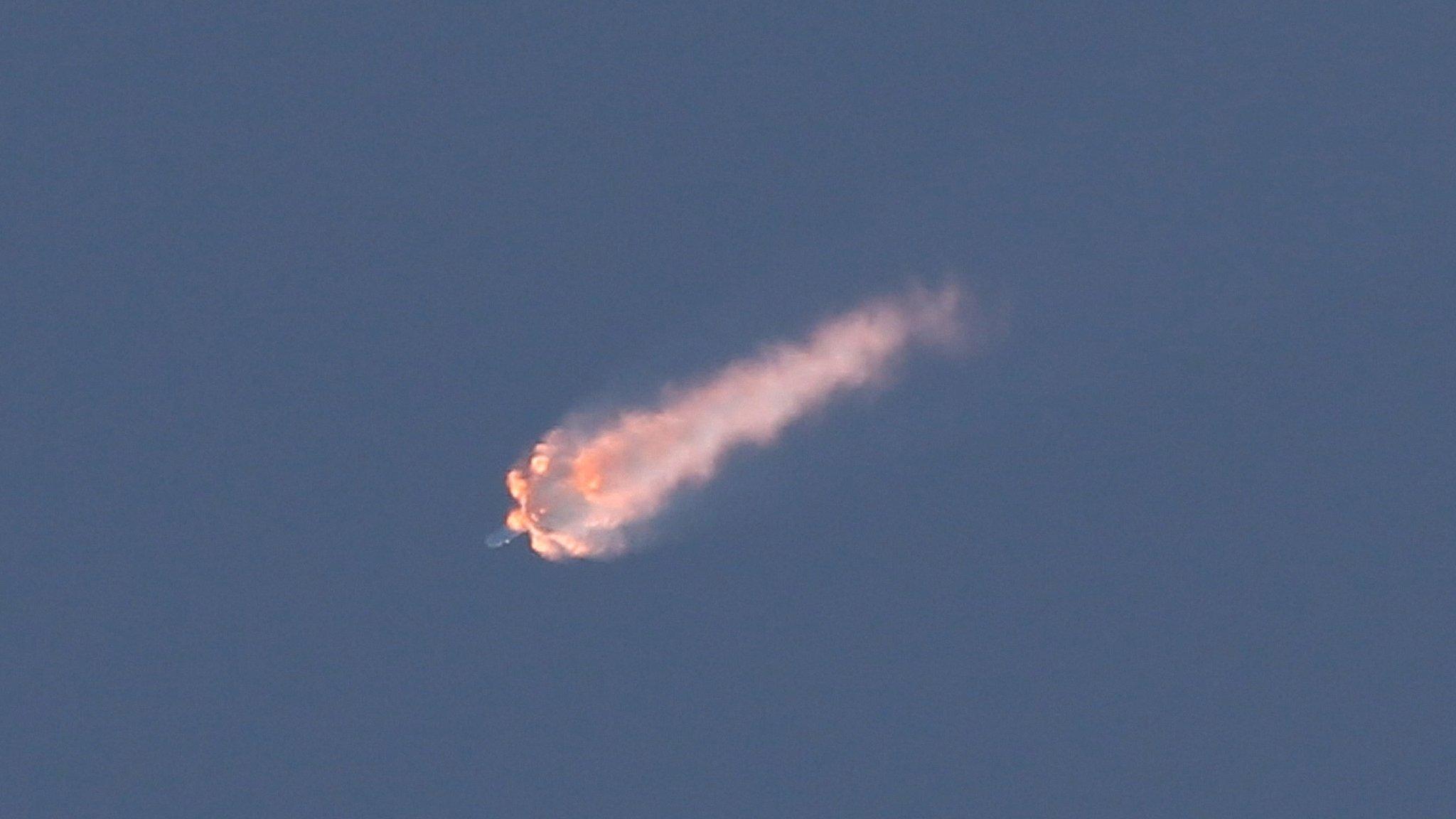 A SpaceX Falcon 9 rocket on its seventh official Commercial Resupply (CRS) mission to the orbiting International Space Station breaks apart on Sunday, June 28, 2015, after launching from Launch Complex 40 at the Cape Canaveral Air Force Station in Florida.