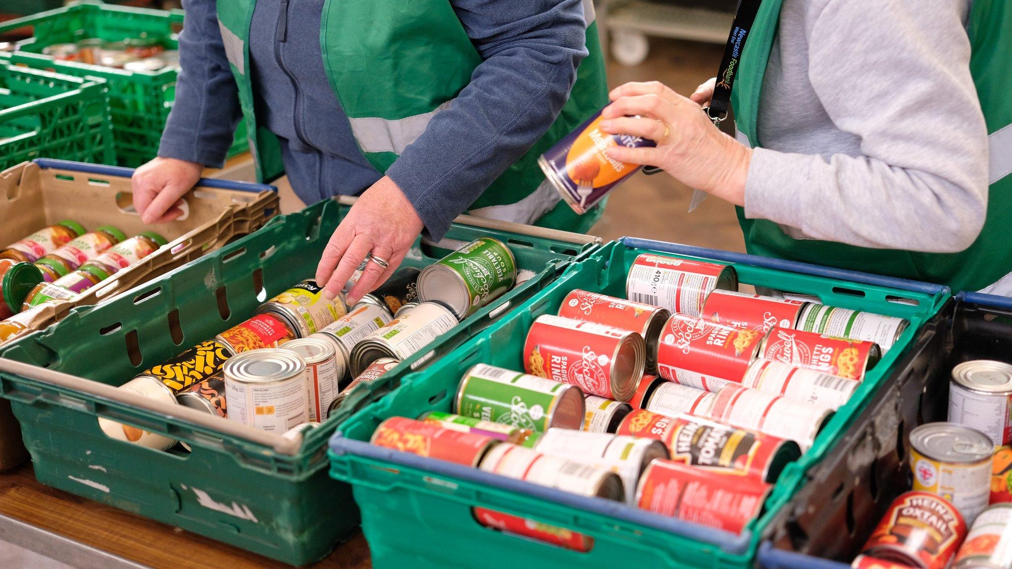 Volunteers from Newcastle West End Foodbank giving out food parcels to clients at Venerable Bede Church Hall