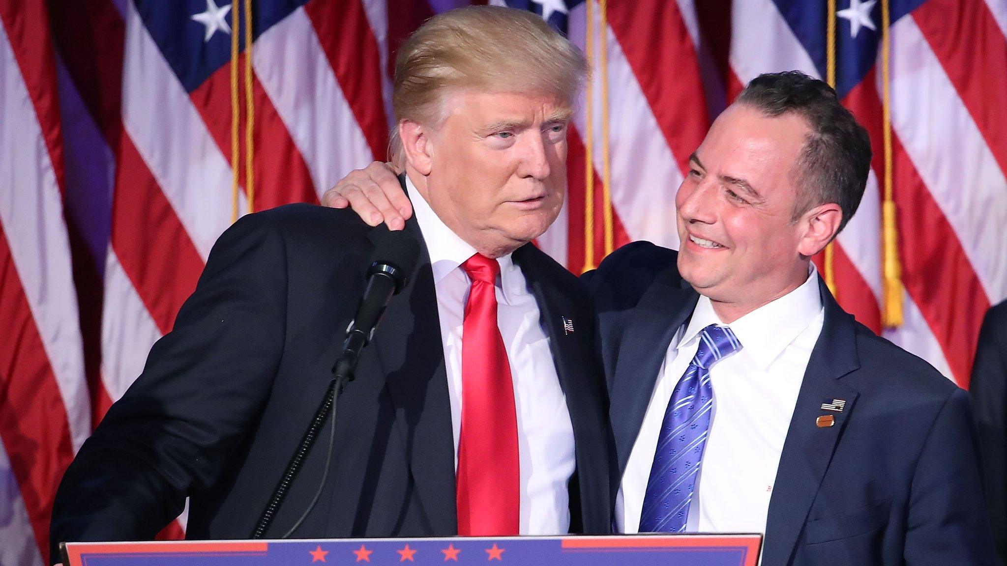 Republican president-elect Donald Trump and Reince Priebus, chairman of the Republican National Committee, embrace during his election night event at the New York Hilton Midtown in the early morning hours of 9 November 2016 in New York City