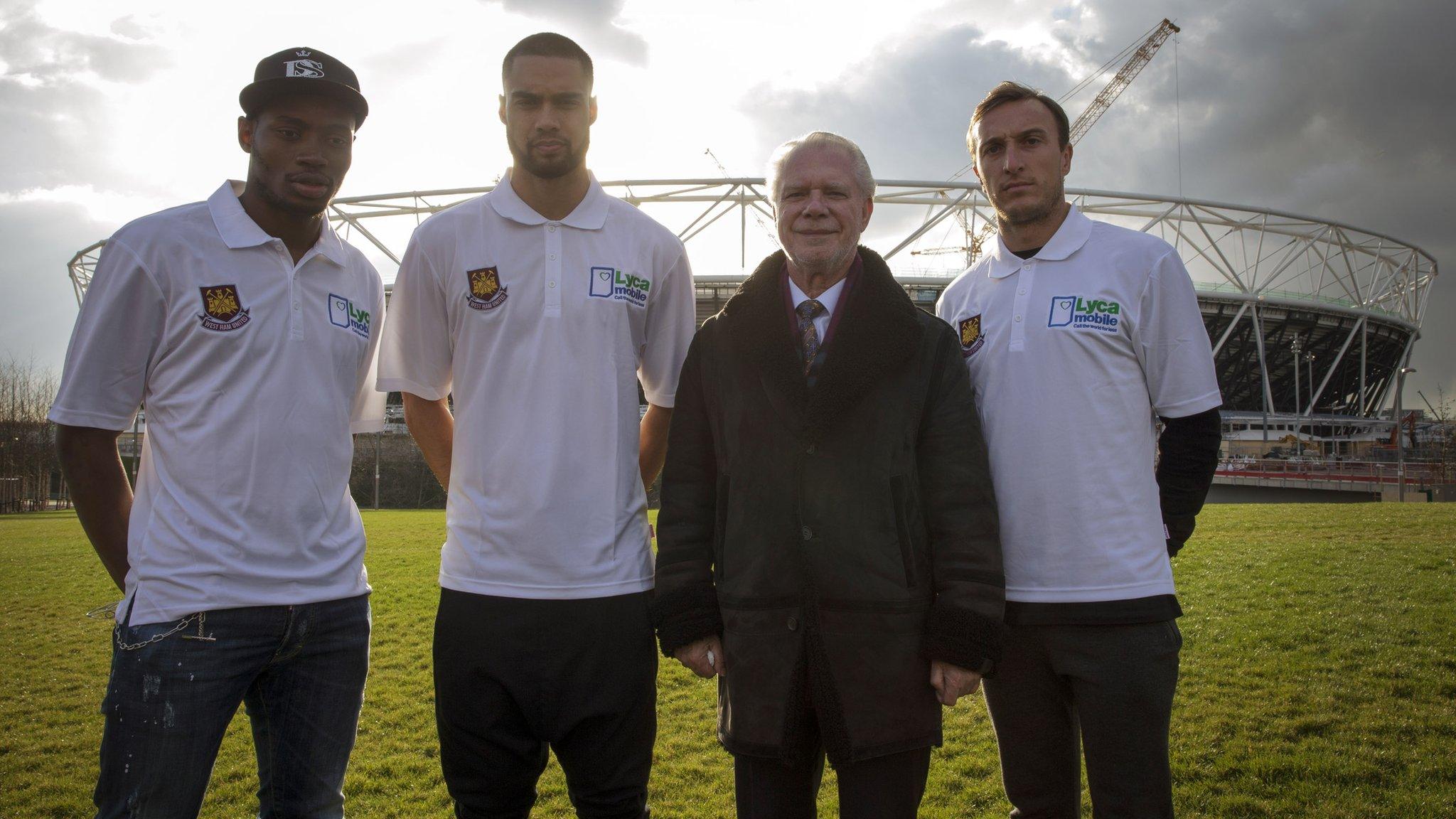 West Ham official and players stand outside Olympic Stadium