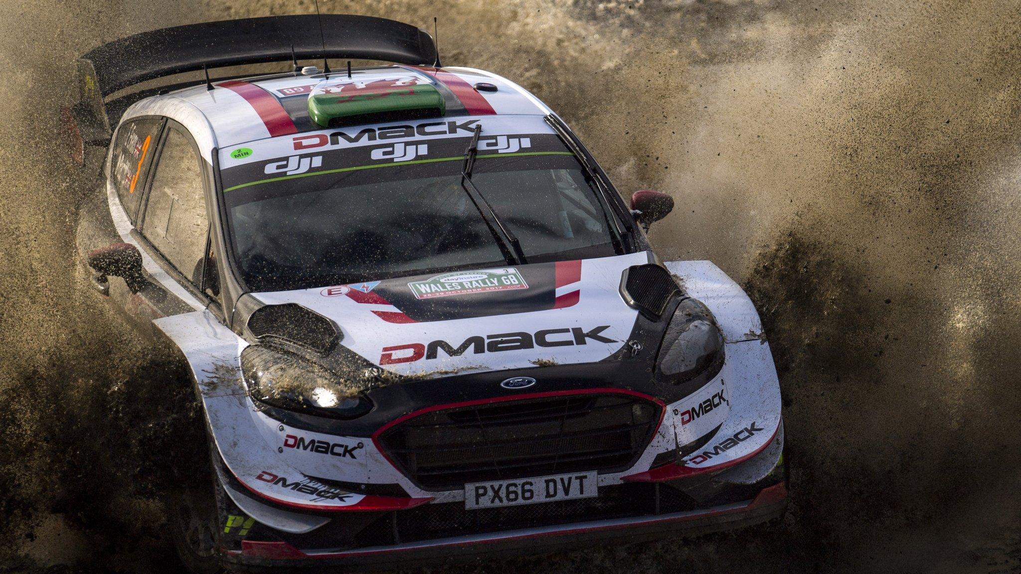 Elfyn Evans and Daniel Barritt kick up gravel as they head for victory in the 2017 Wales Rally GB