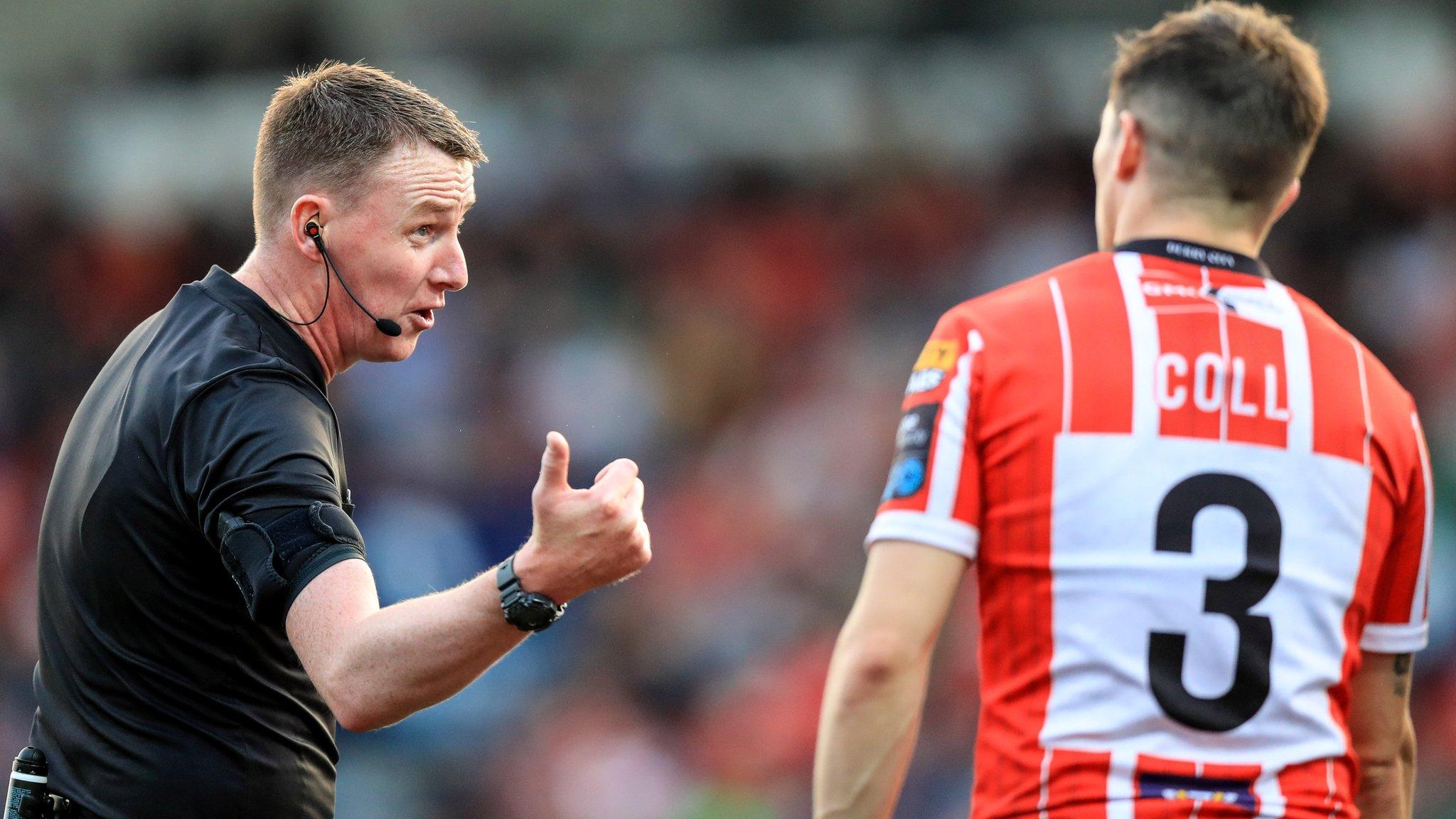 Derry City's Ciaran Coll talks to referee Damien McGraith at the final whistle at the Brandywell