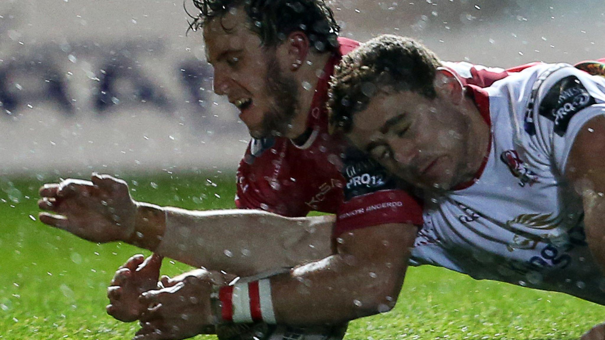 Dan Jones (left) challenges Paddy Jackson