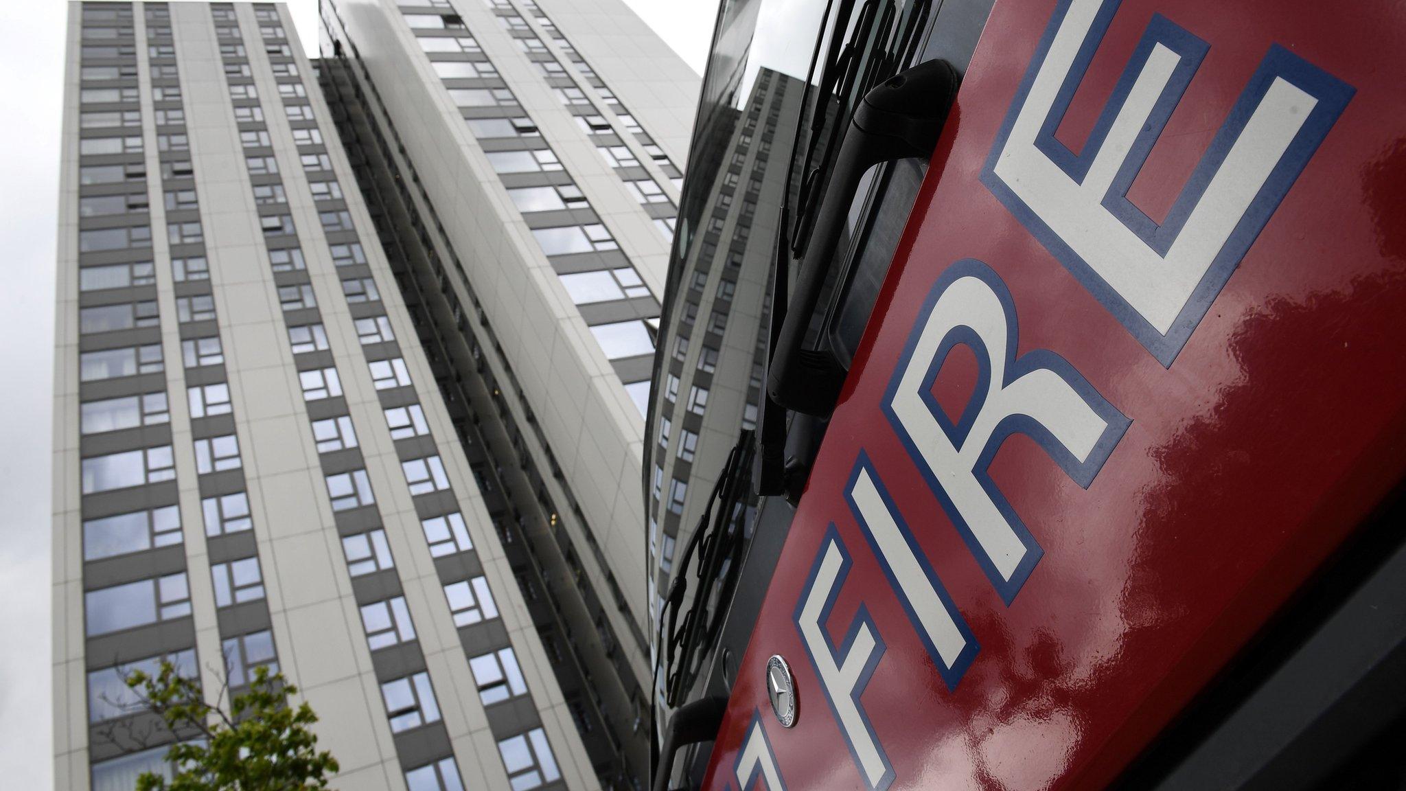 A fire engine outside a tower block