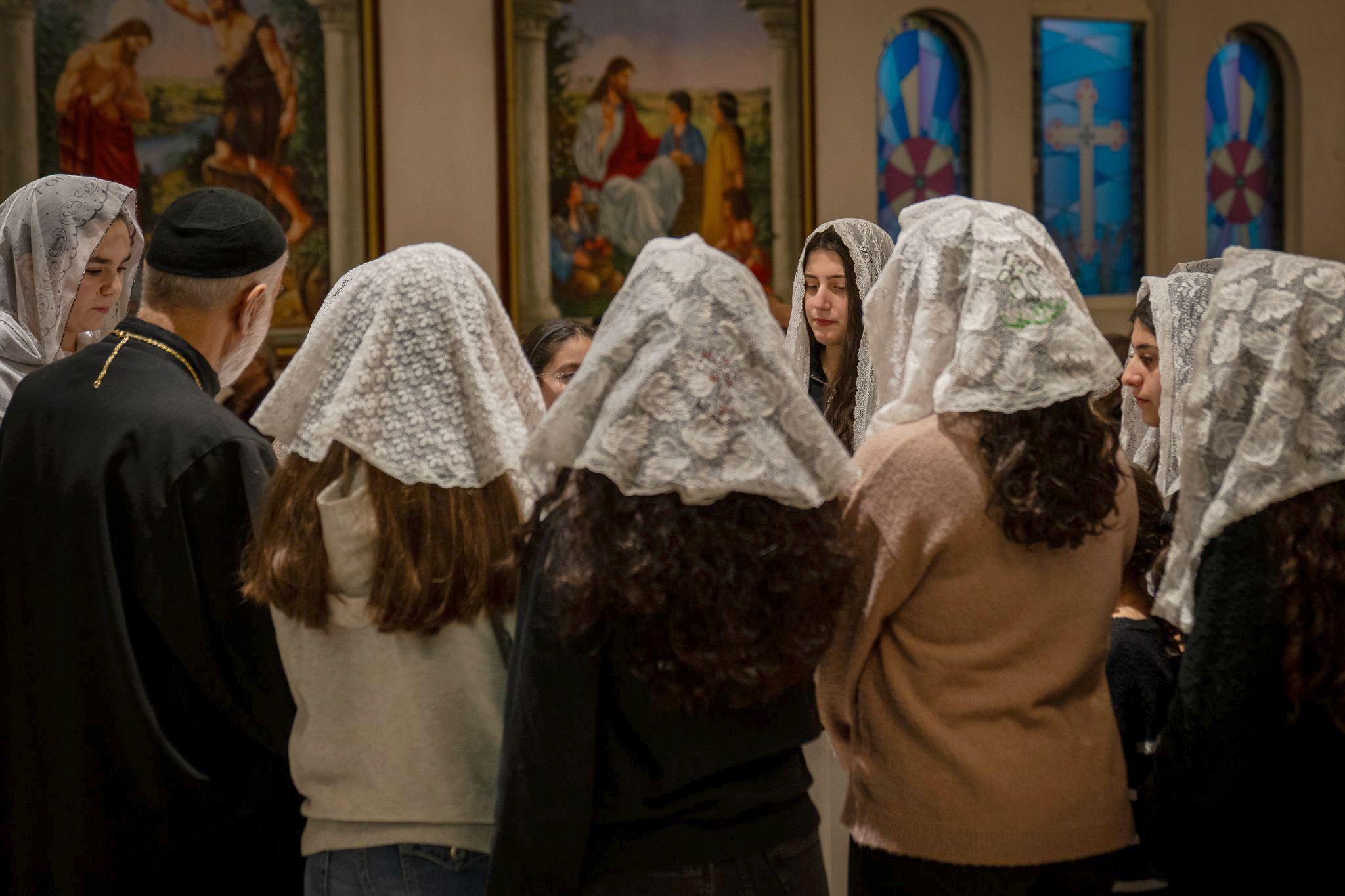 Members of the Syrian orthodox congregation singing hymns at a memorial service in Orebro.