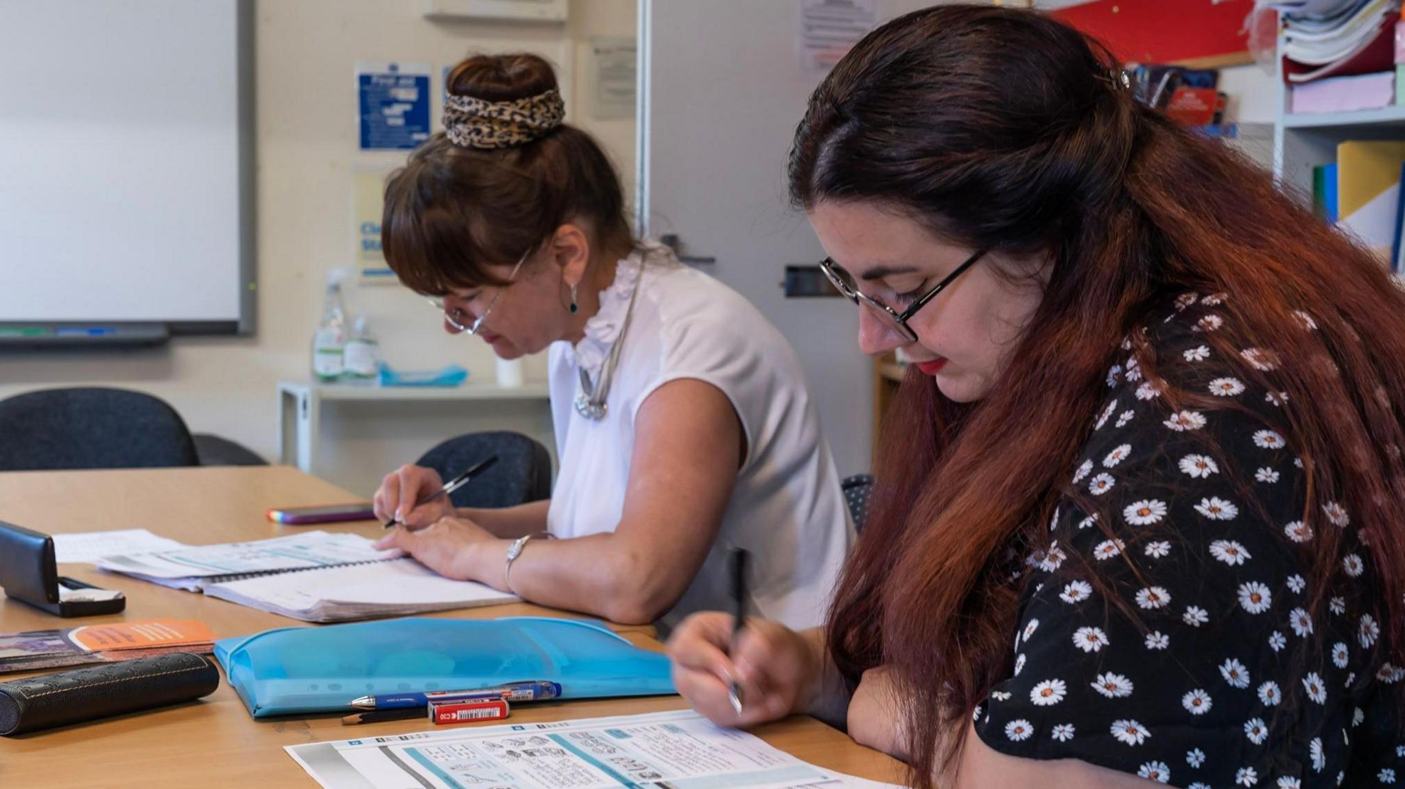 People learning in a classroom