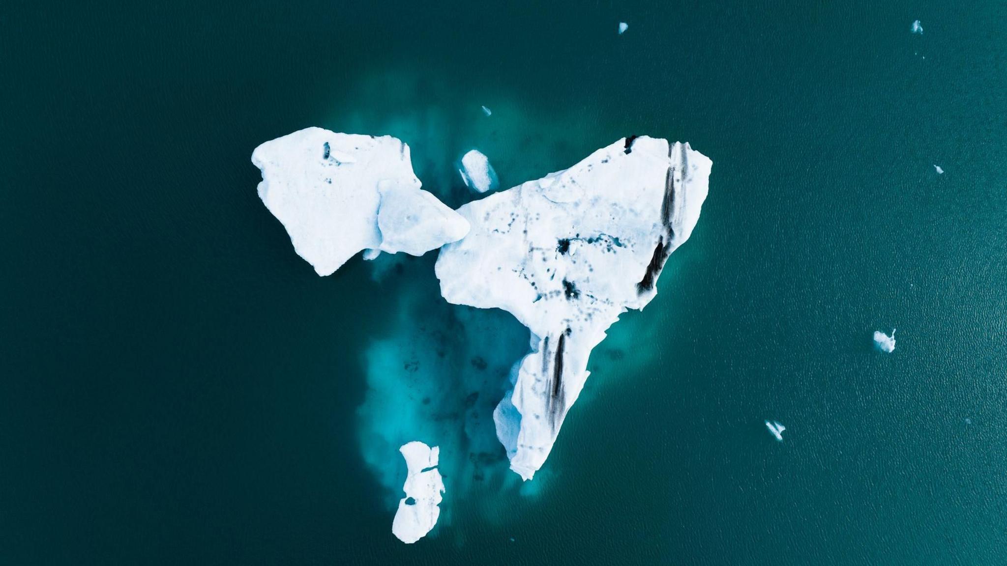 An aerial image of a broken iceberg.