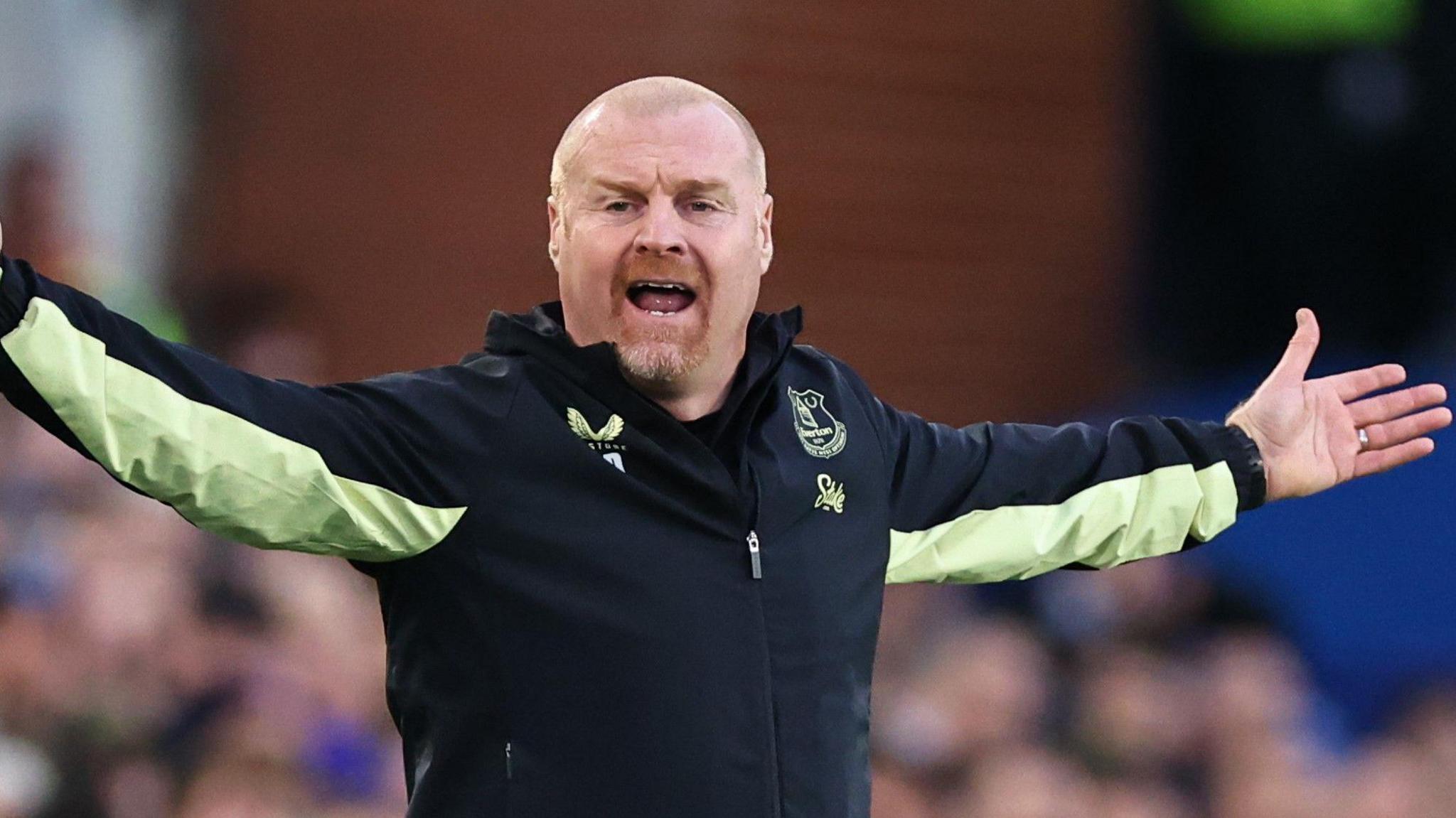 Sean Dyche with arms outstretched 
