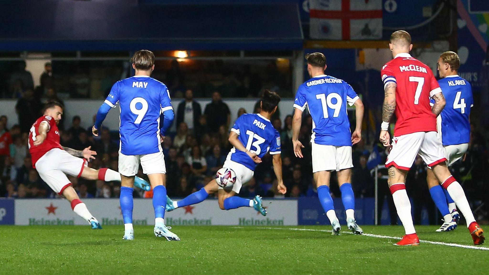 Jack Marriott swings at the ball with his right foot and gets a crucial deflection off Seung-Ho Paik  