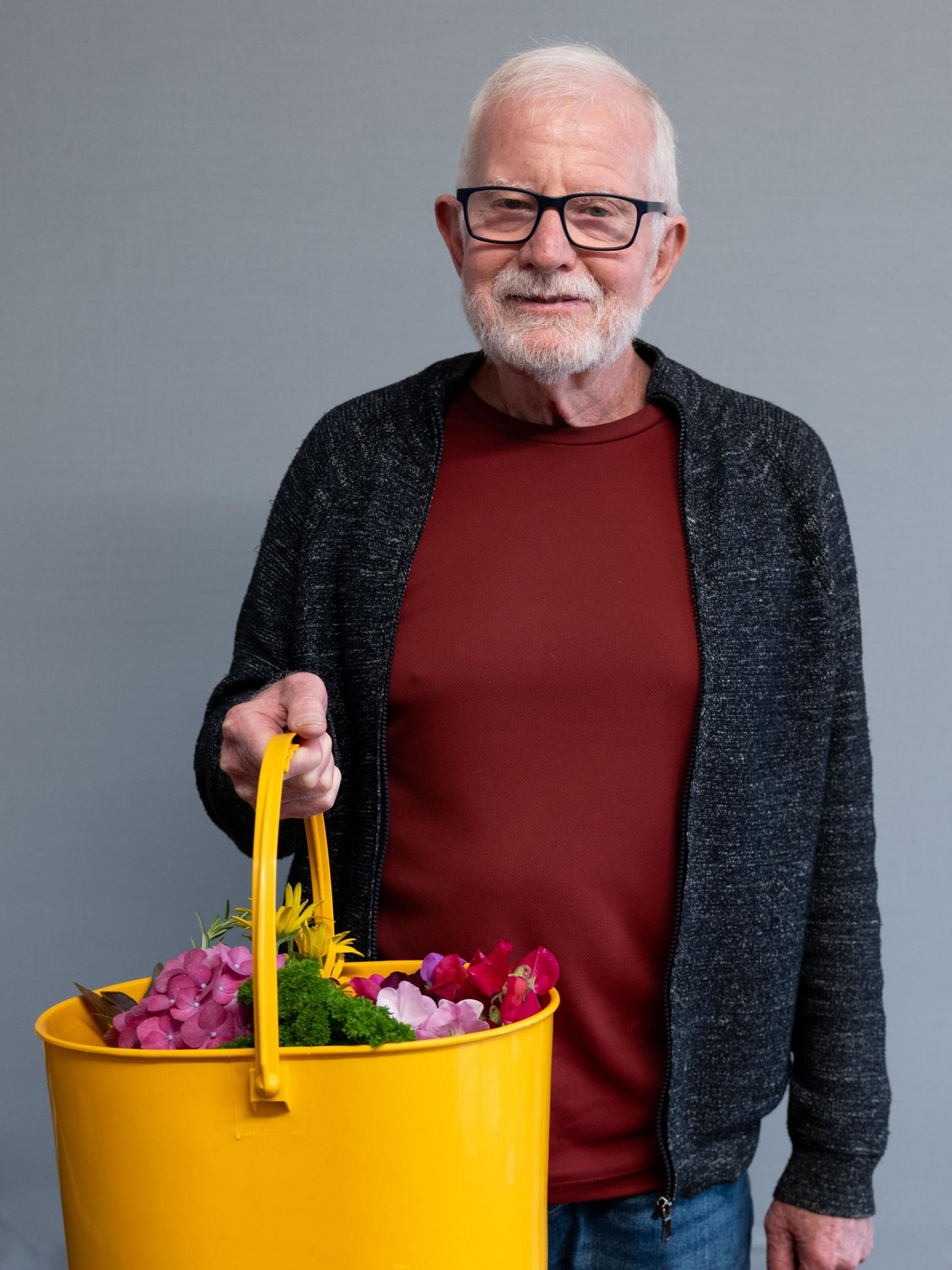 Bob Stevenson with a basket of flowers