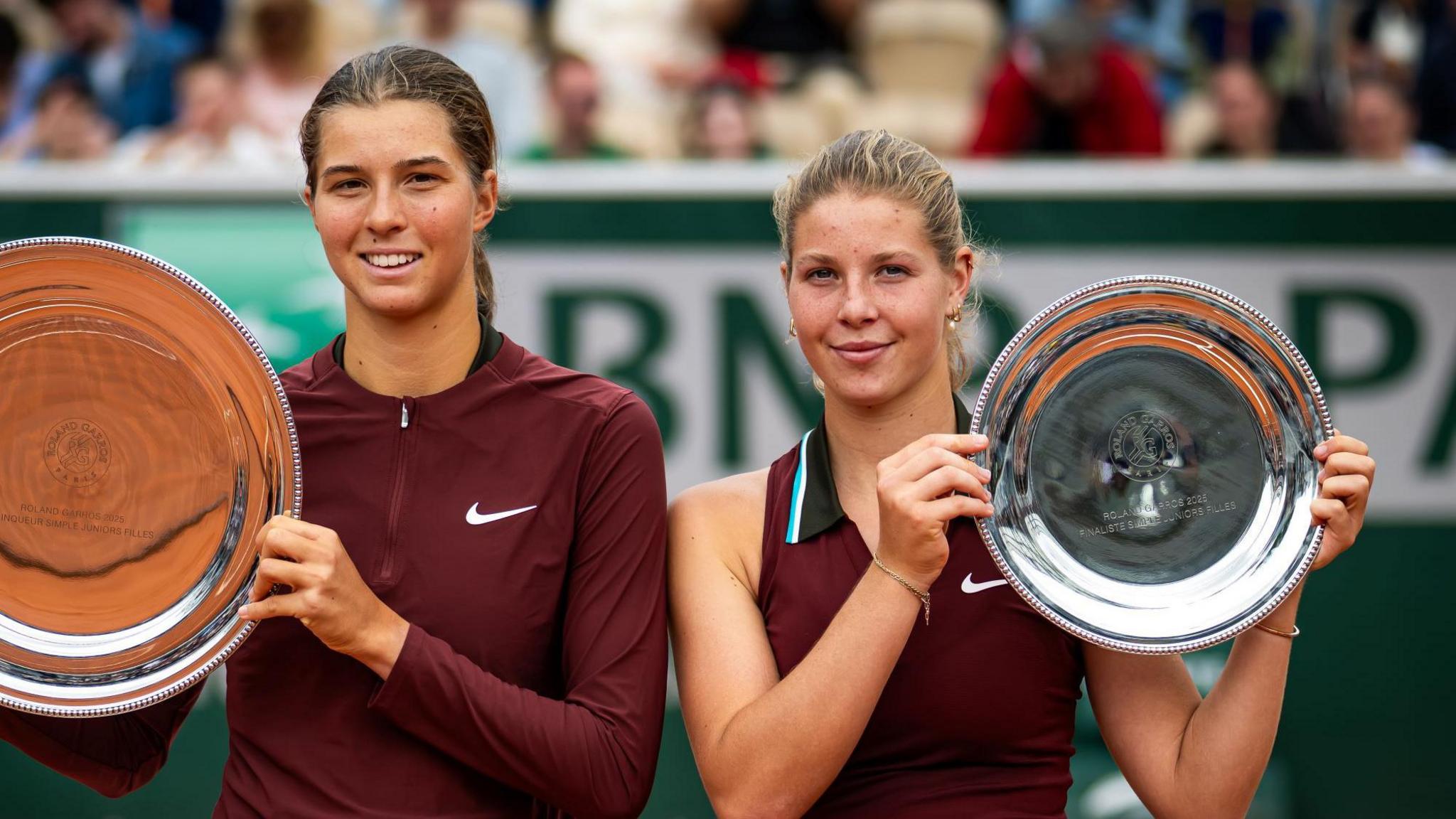 Lilli Tagger and Hannah Klugman lift their French Open trophies