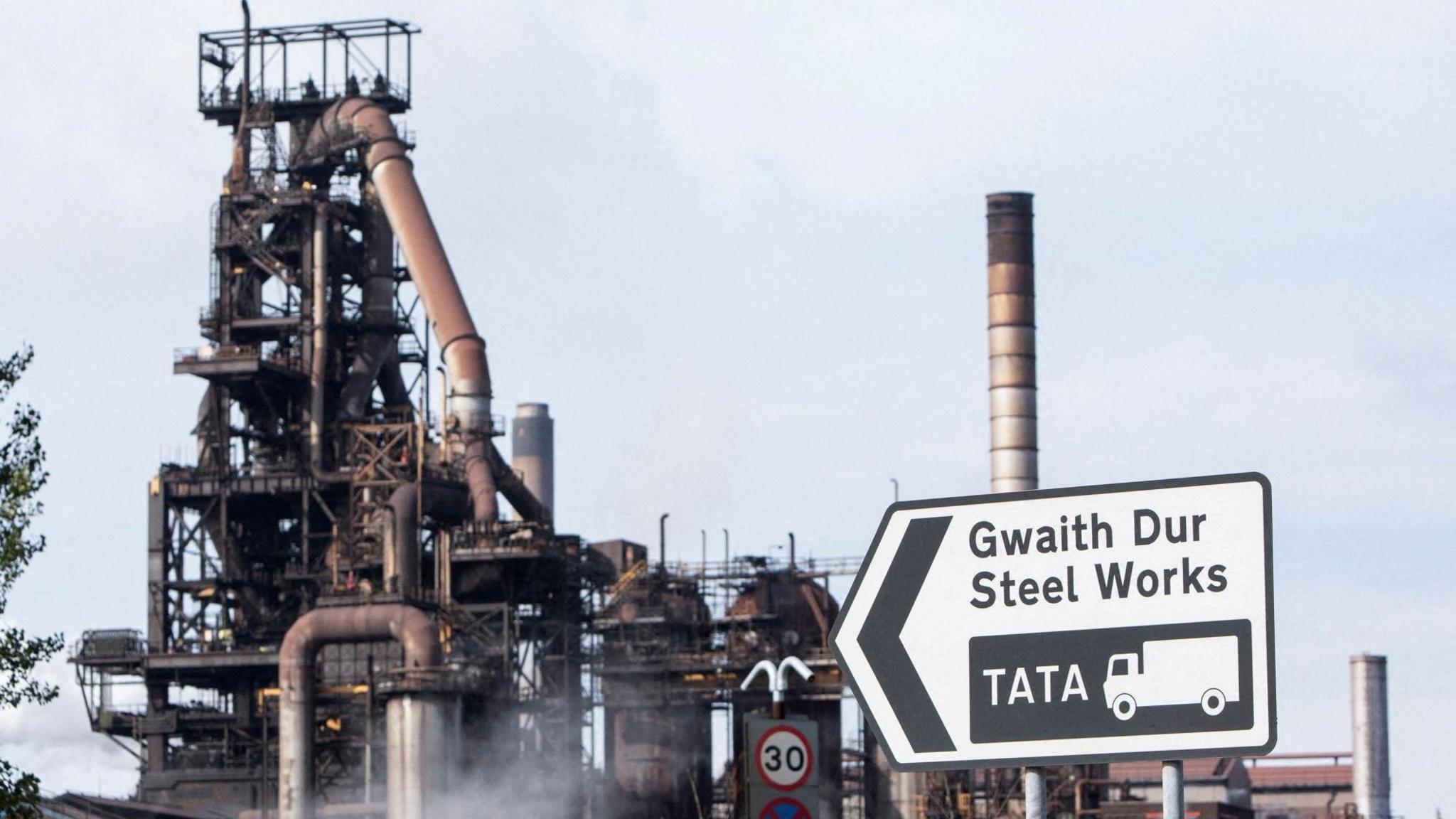 A view of the Port Talbot steelworks, with a road sign in view