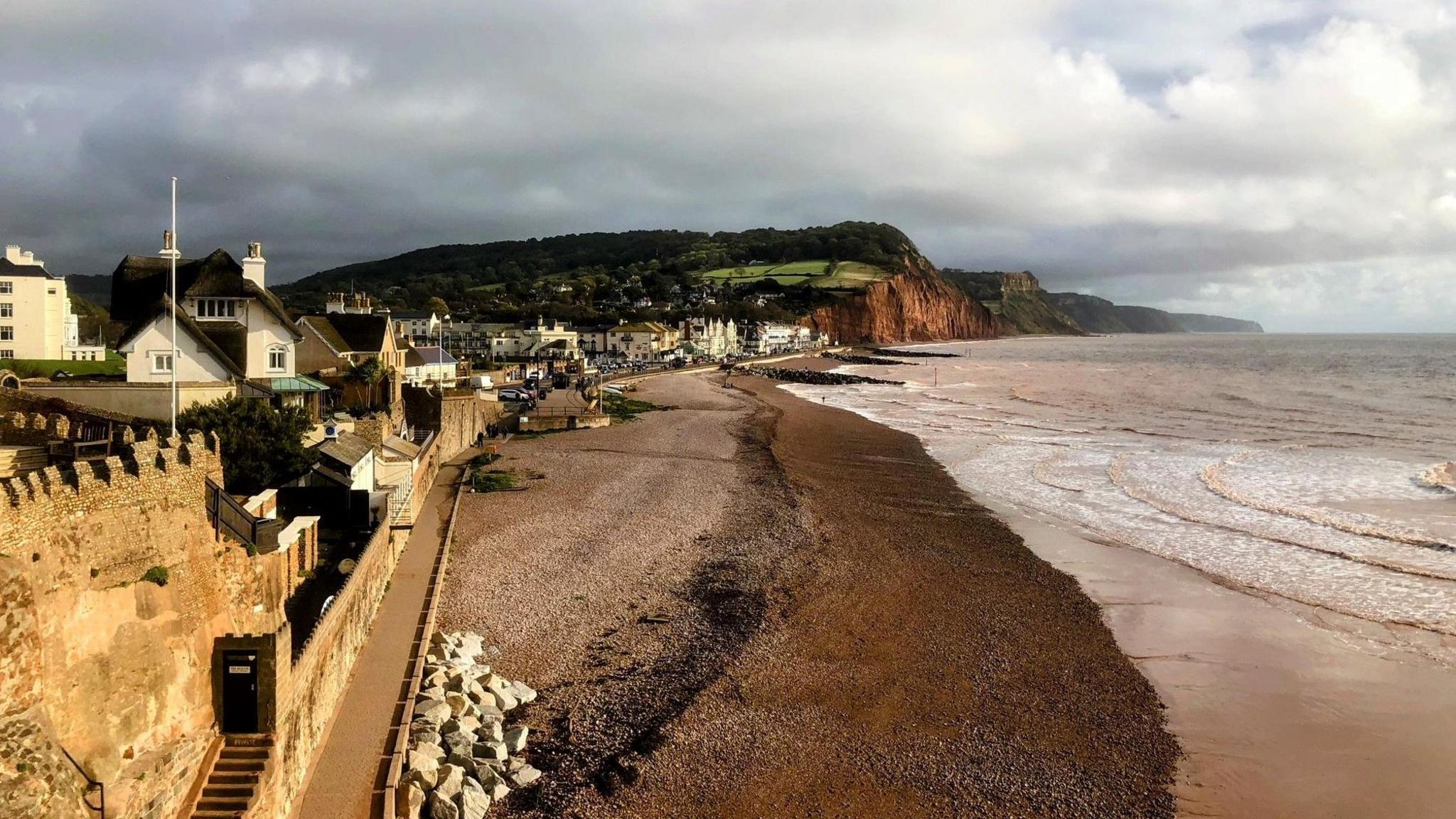 The beach, houses and coastline at Sidmouth in east Devon