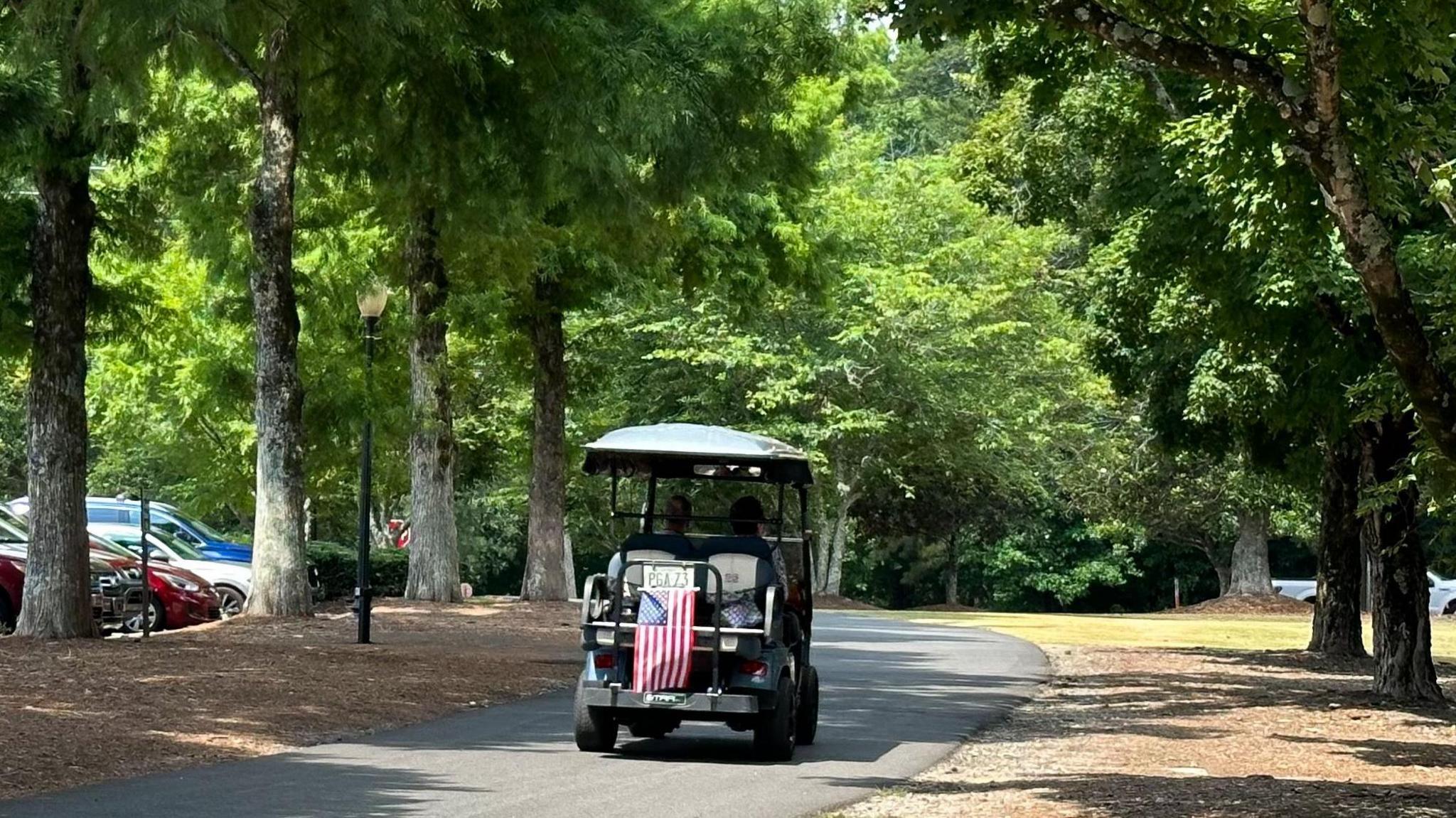 A golf cart drives through Peachtree City, Georgia 