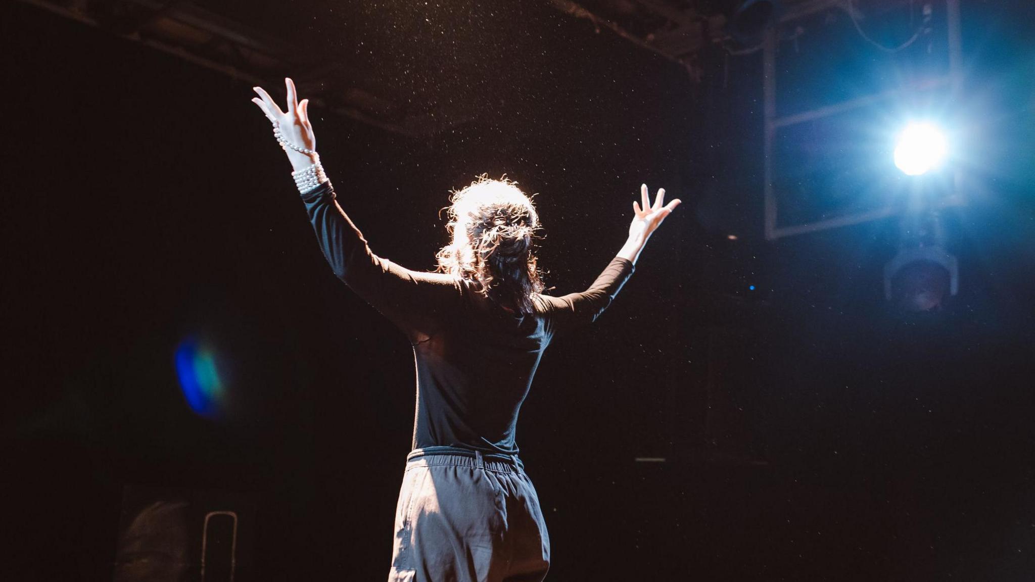 Stage actor under a spotlight