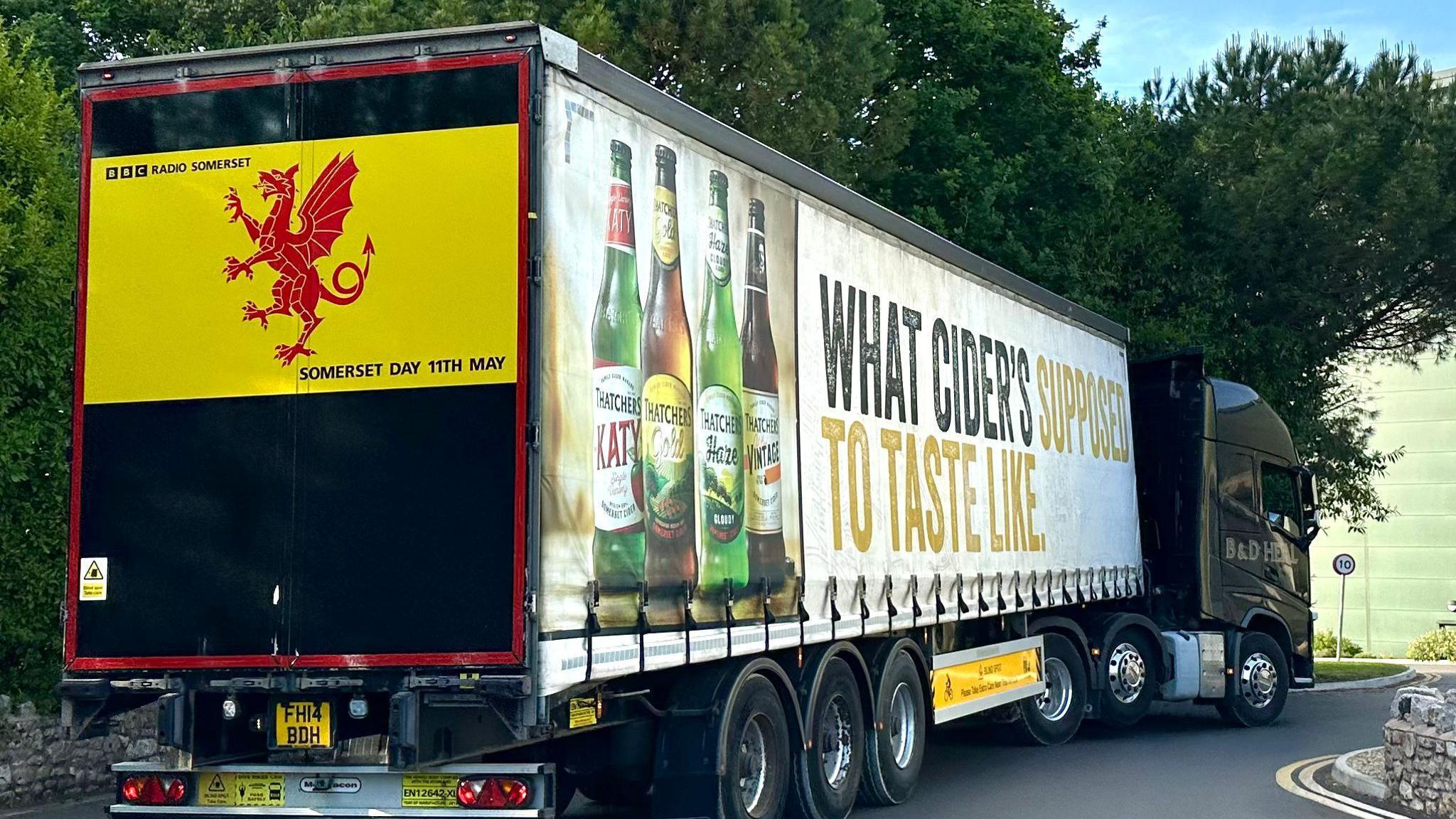 A Thatchers delivery truck has the Somerset flag displayed on the rear.