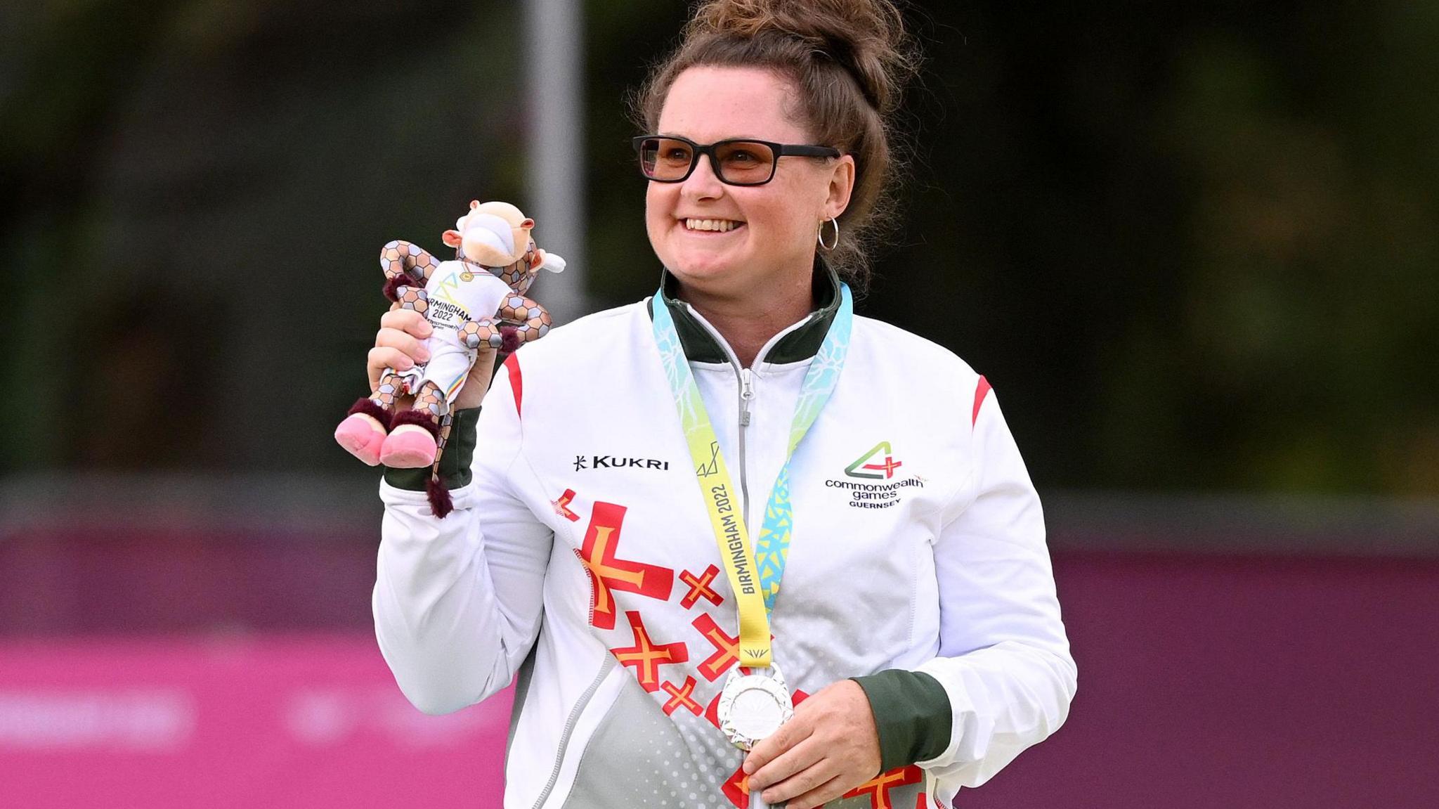 Lucy Beere holds her silver medal