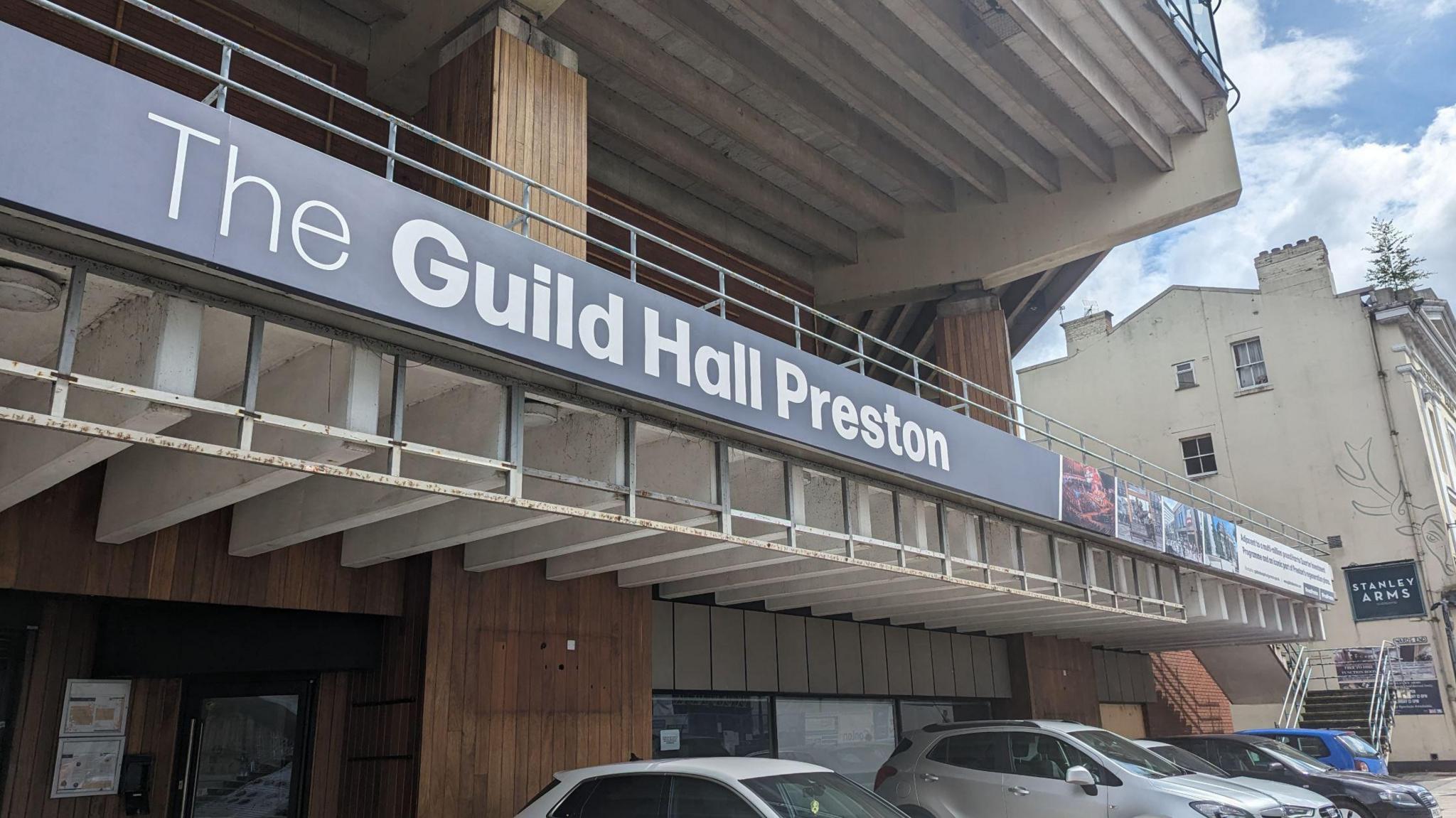 Close up on The Guild Hall Preston sign from the outside of the building.