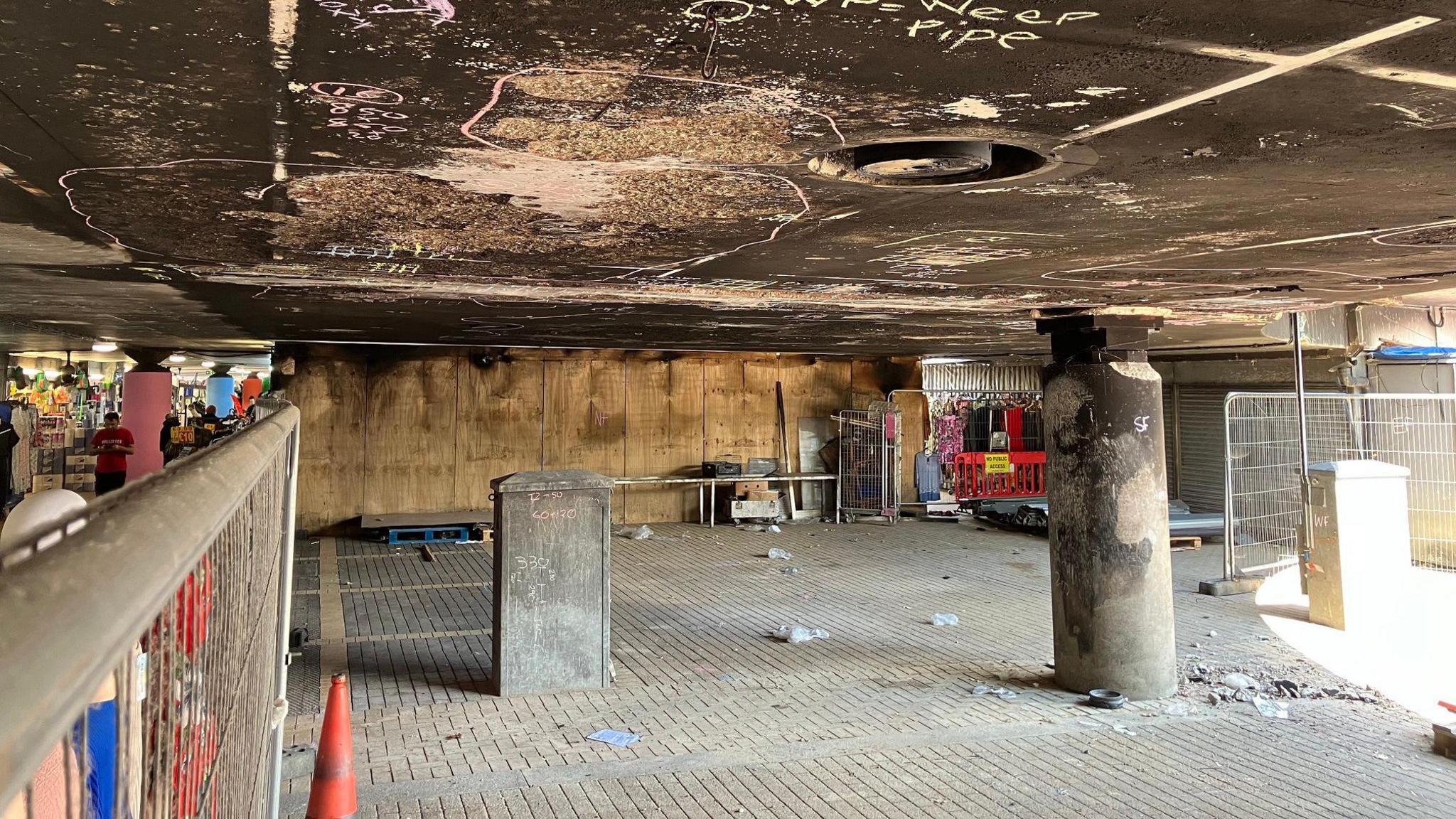 A picture of the fire damaged Secklow bridge in Milton Keynes. You can see the market underneath it on the left.