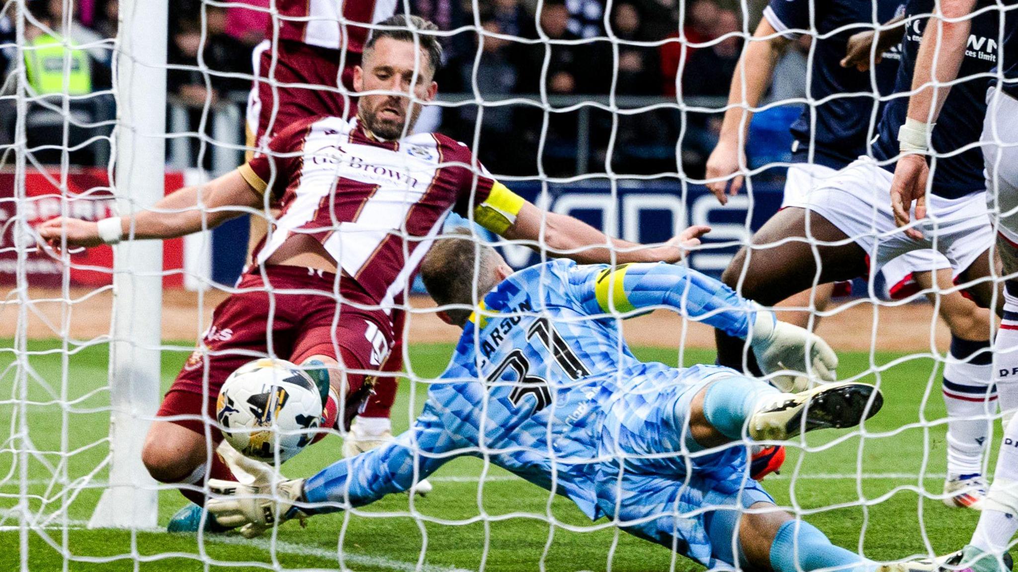 St Johnstone’s Nicky Clark scores to make it 2-1  during a William Hill Premiership match between Dundee and St Johnstone at the Scot Foam Stadium at Dens Park