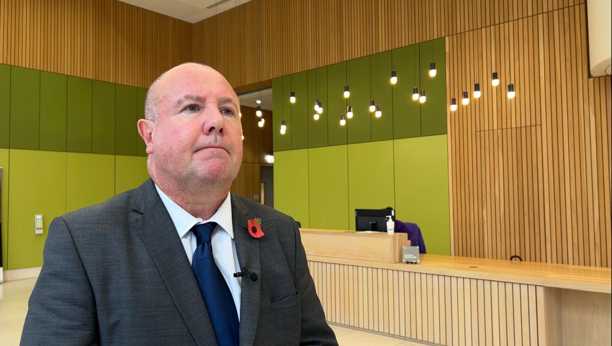 Councillor Jim O'Boyle, Coventry City Council Cabinet Member for Regeneration, standing in Friargate One.