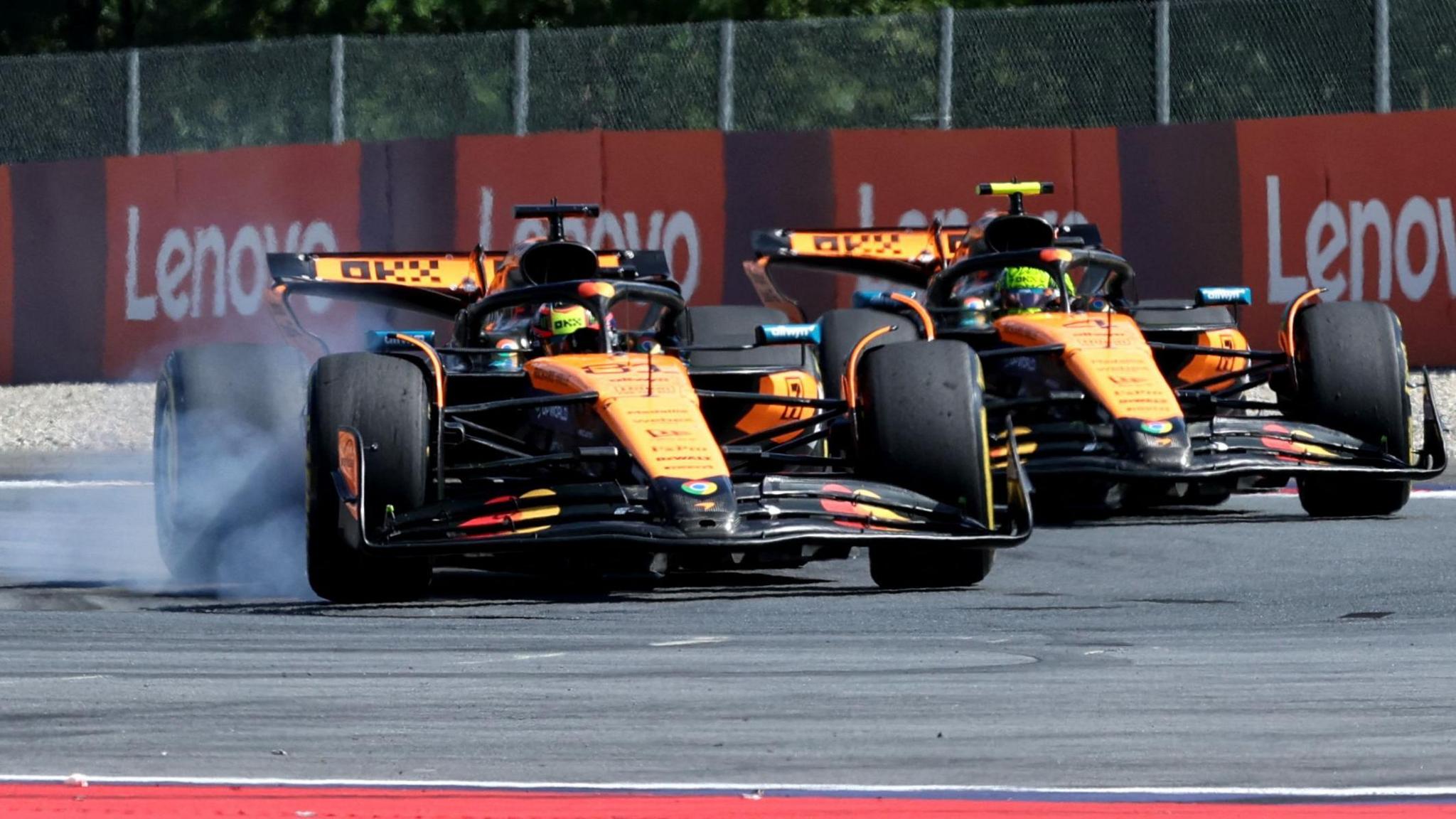 The McLarens of Lando Norris and Oscar Piastri battle for the lead in the Austrian Grand Prix, as Piastri locks up his front-right tyre