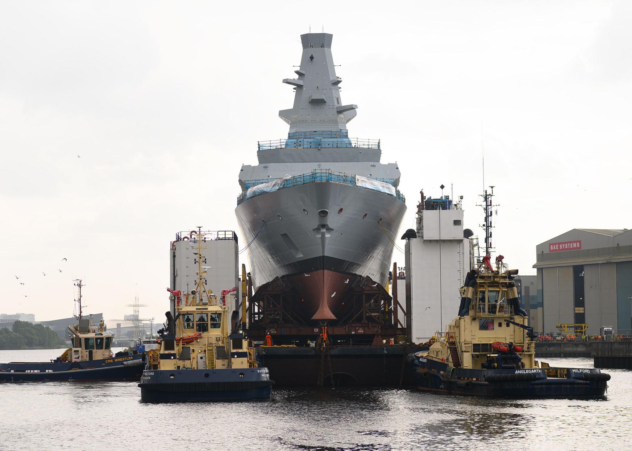 New Navy frigate HMS Cardiff makes first journey on giant barge - BBC News