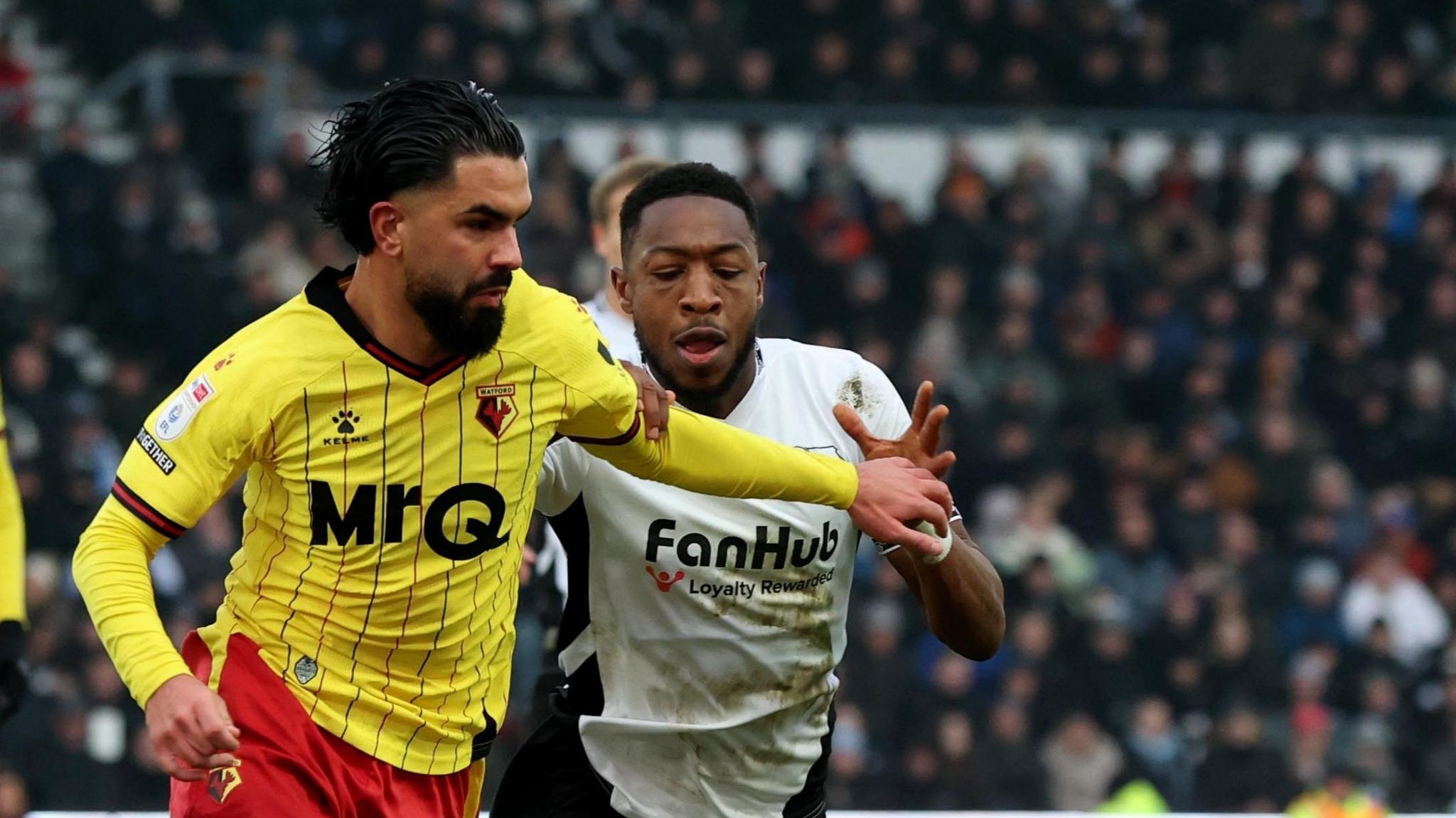 Watford's Imran Louza (left) and Derby County's Ebou Adams battle for the ball 