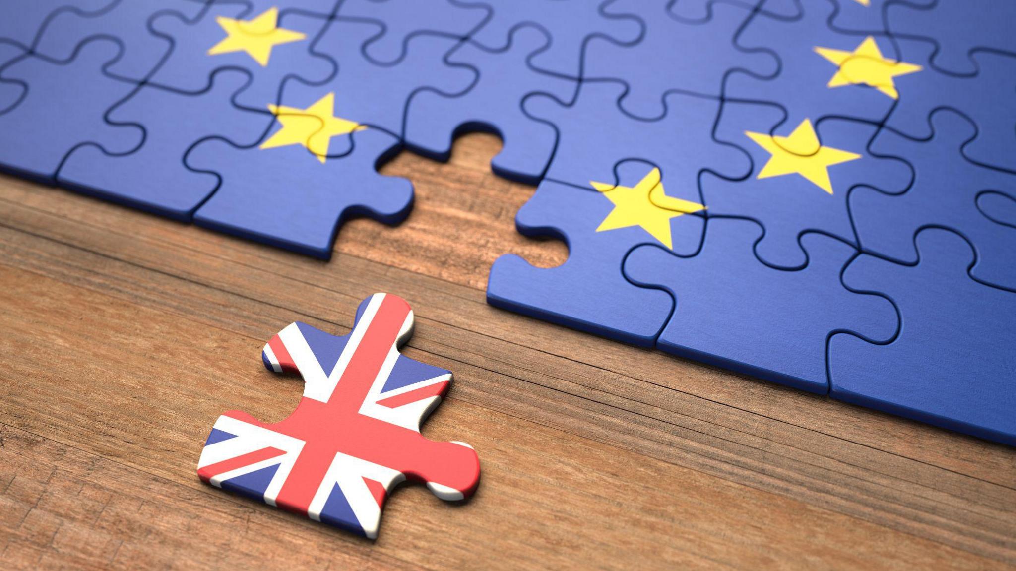 a jigsaw puzzle showing the uk piece has left the european union puzzle.