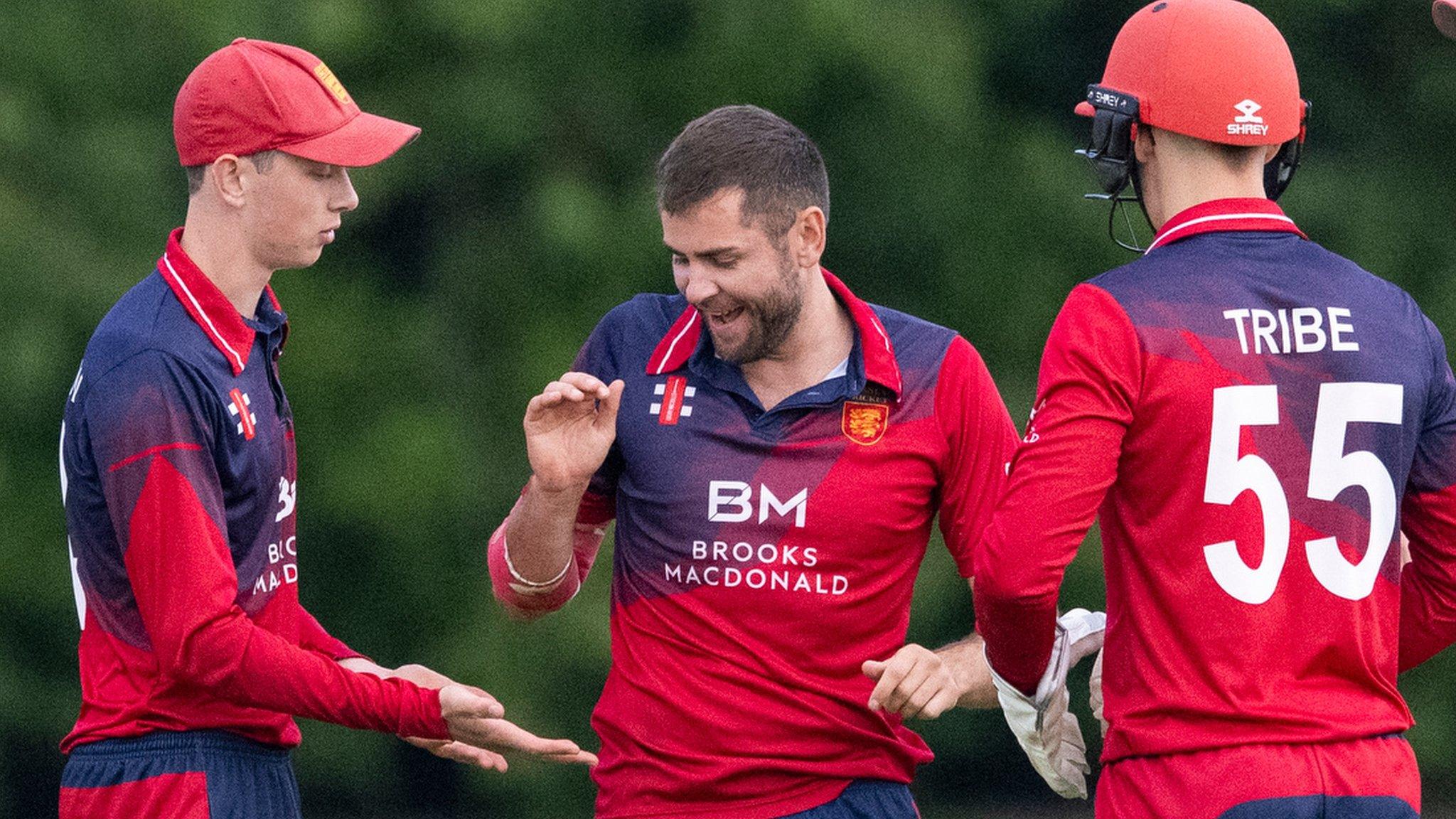 Jersey cricket team celebrate taking a wicket