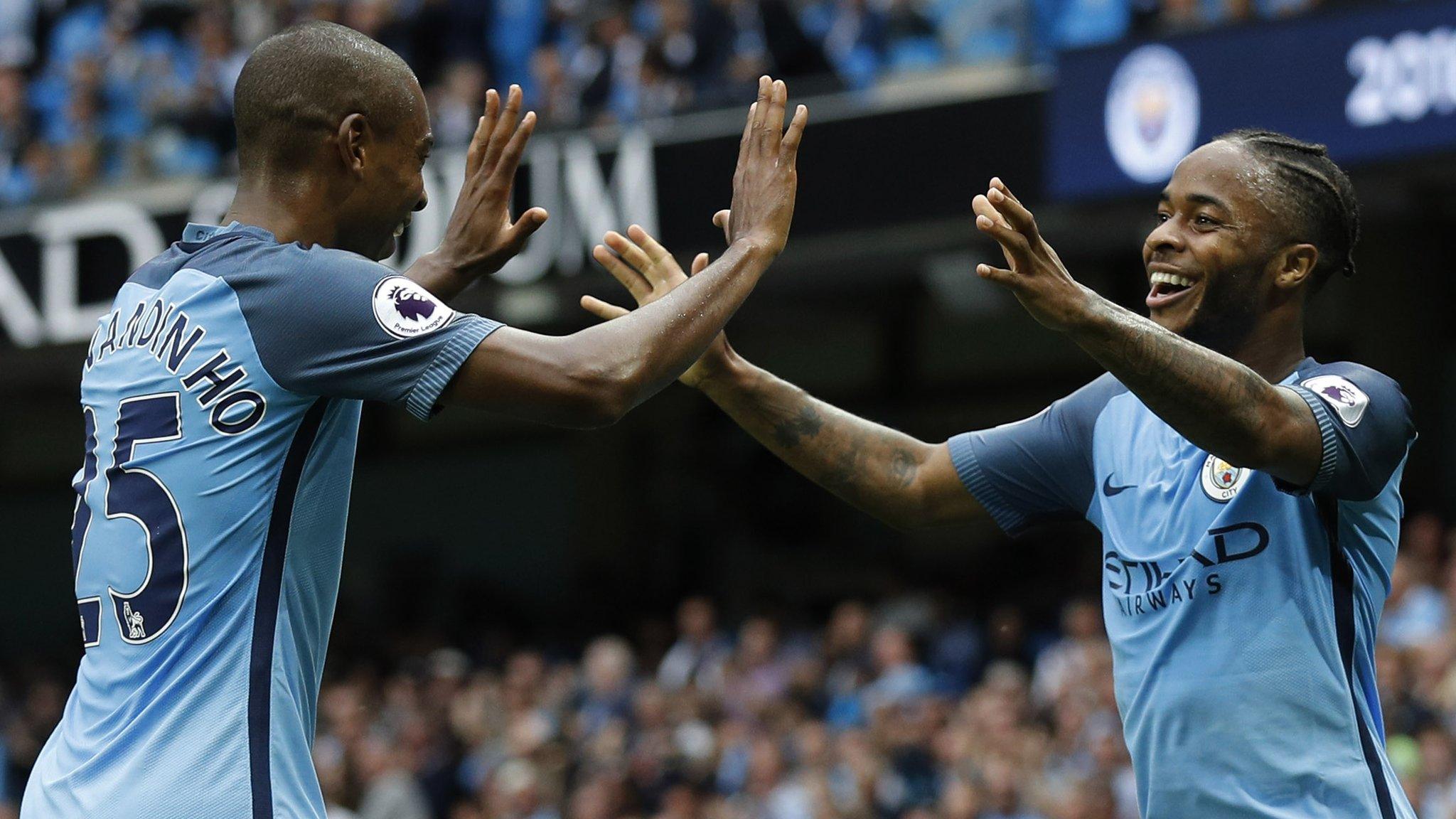 Raheem Sterling and Fernandinho celebrate