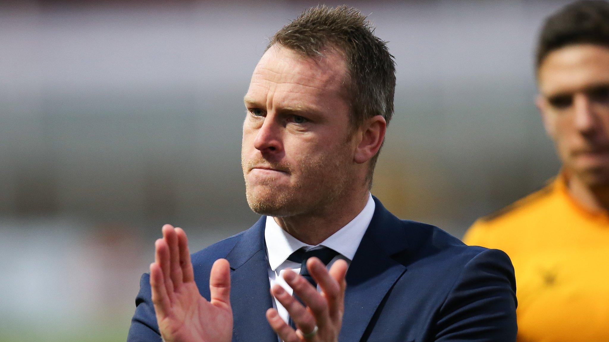 Newport County manager Mike Flynn applauds his team