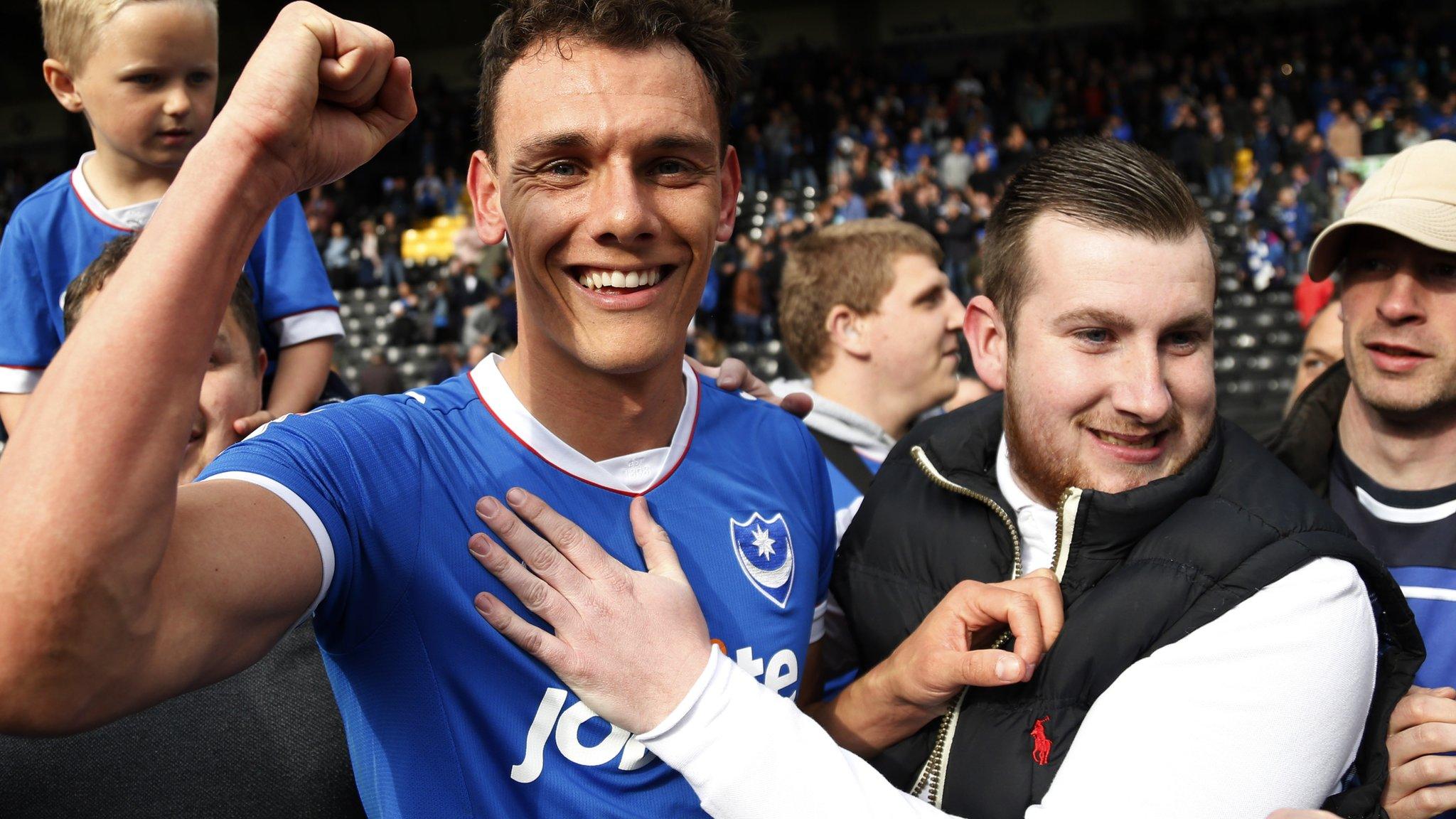 Kal Naismith celebrates promotion with Portsmouth supporters