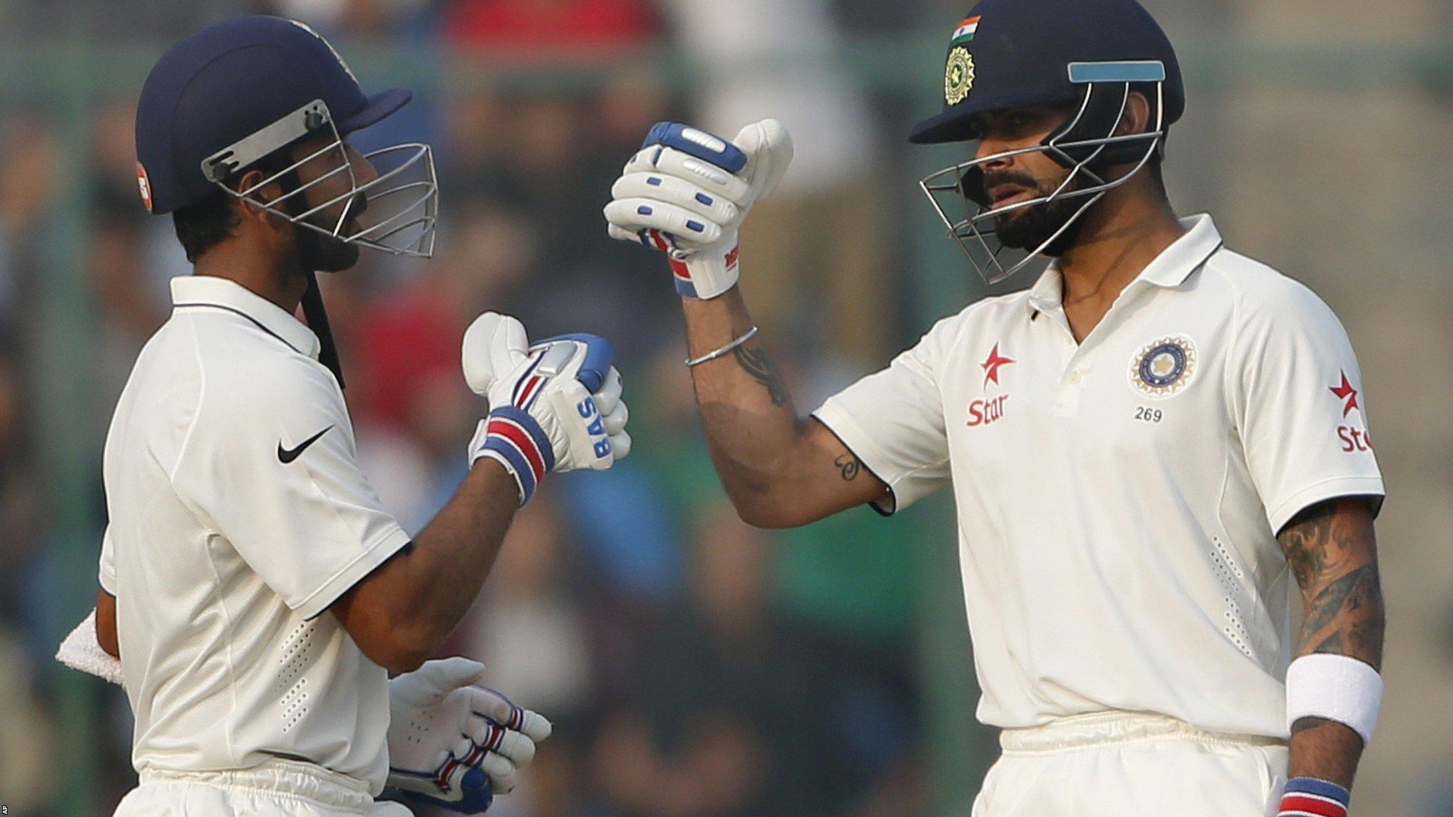 Ajinkya Rahane (left) with his captain Virat Kohli