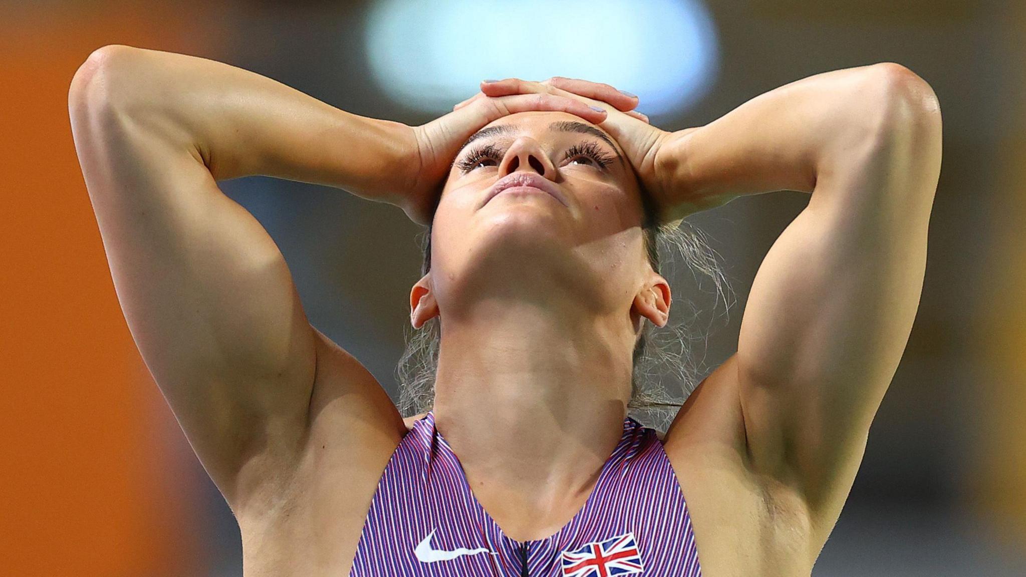 Holly Mills puts here head in her hands at the 2023 Indoor Europan Athletics Championships in Istanbul
