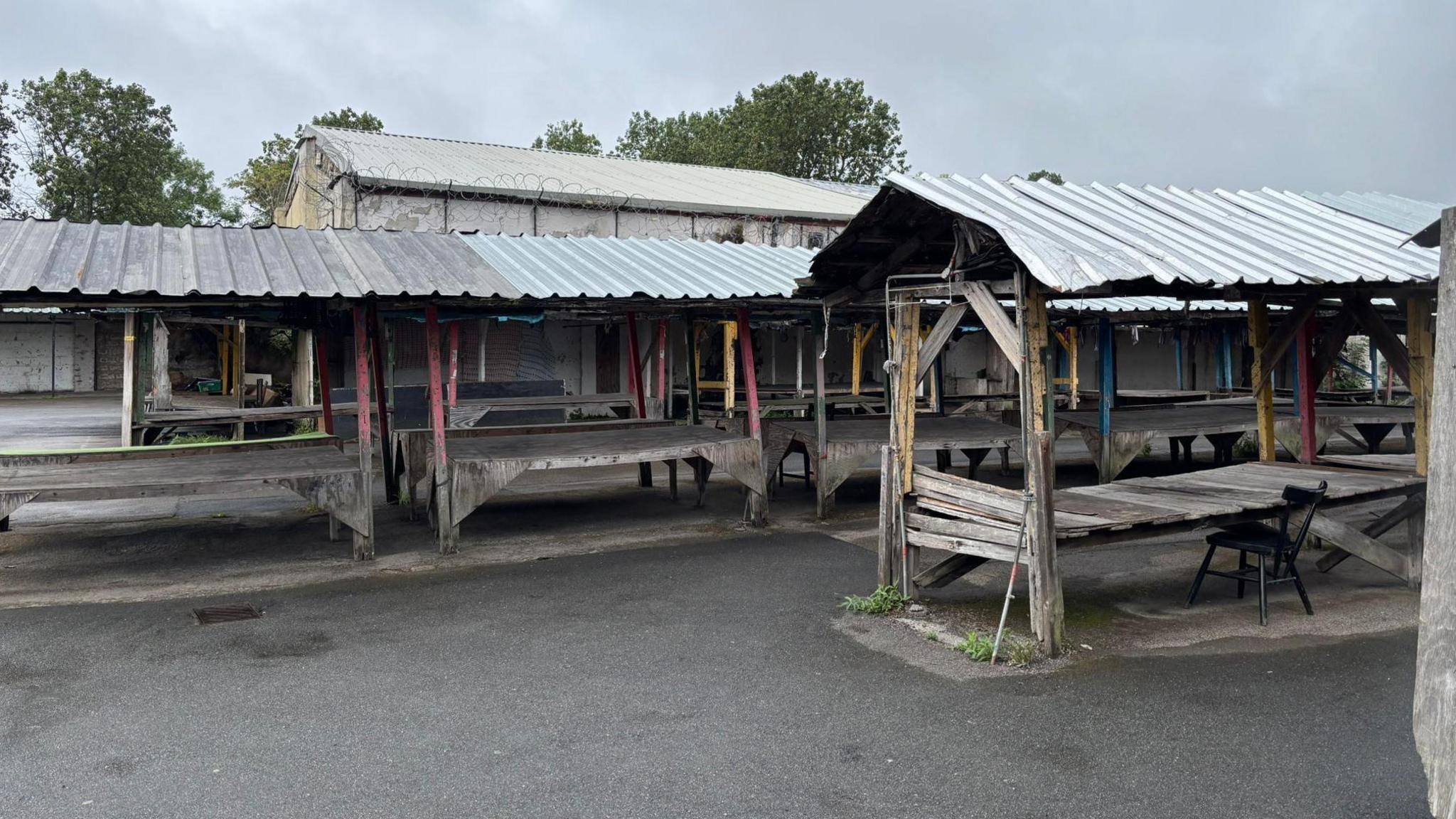 Image shows empty market stalls at the Conran Street Market, which is set to be sold at auction 