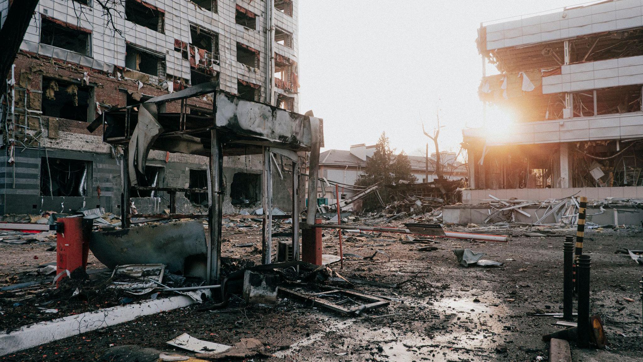 Burnt-out remains of buildings in a residential area.