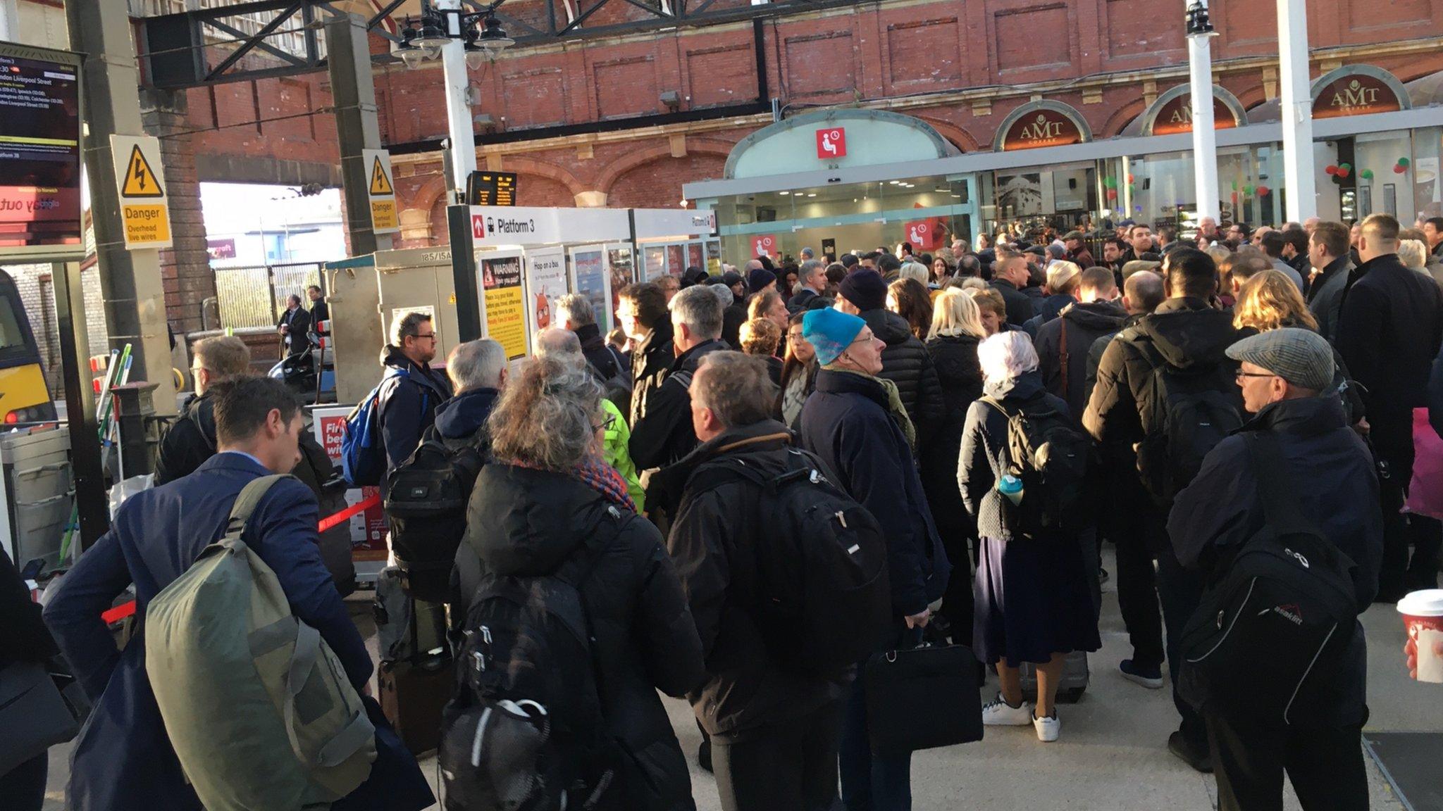 Passengers at Norwich railway station after a train cancellation