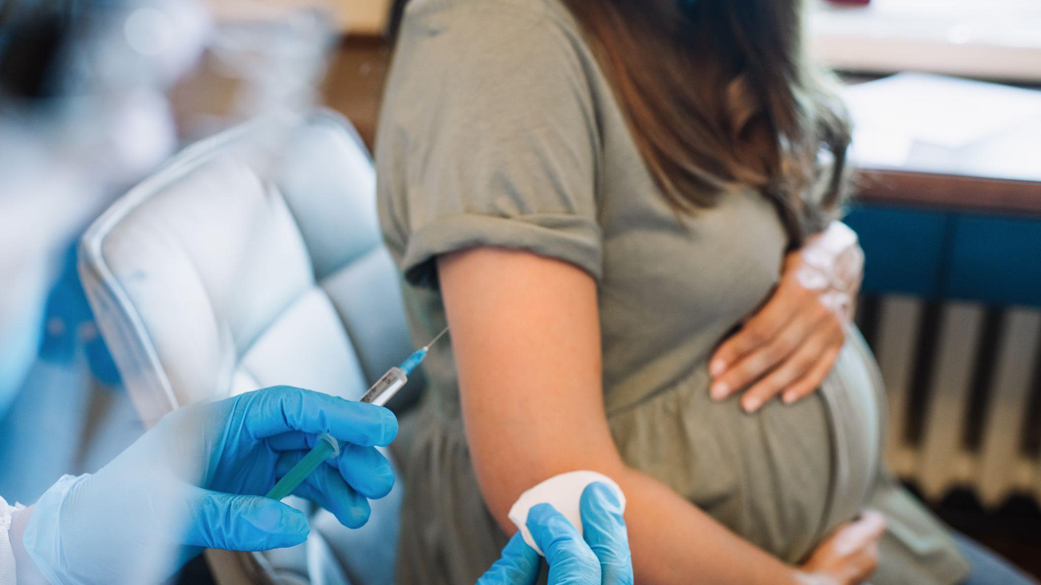 A pregnant woman getting a vaccine (file photo)