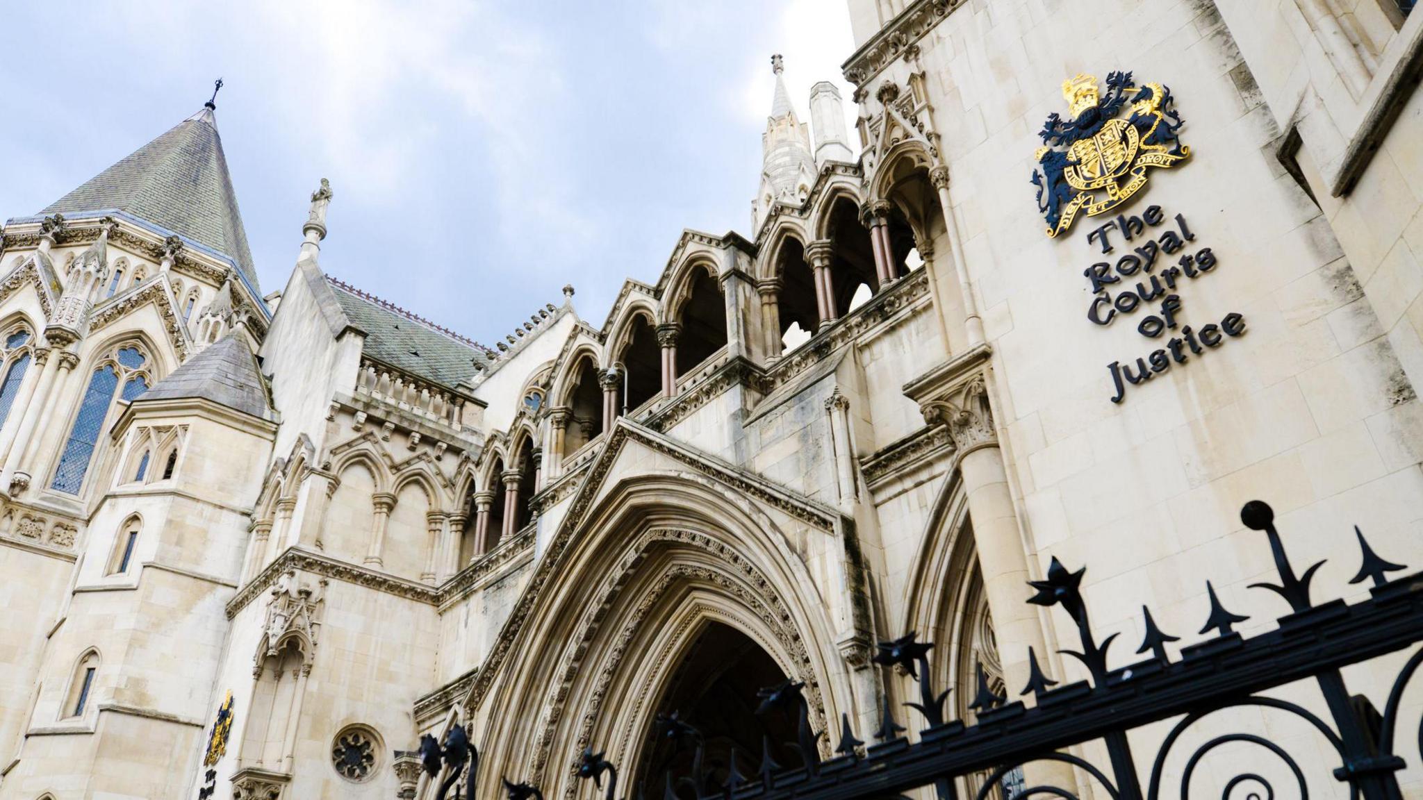 Facade of the Royal Courts of Justice along the Strand in the City of Westminster in London, England.