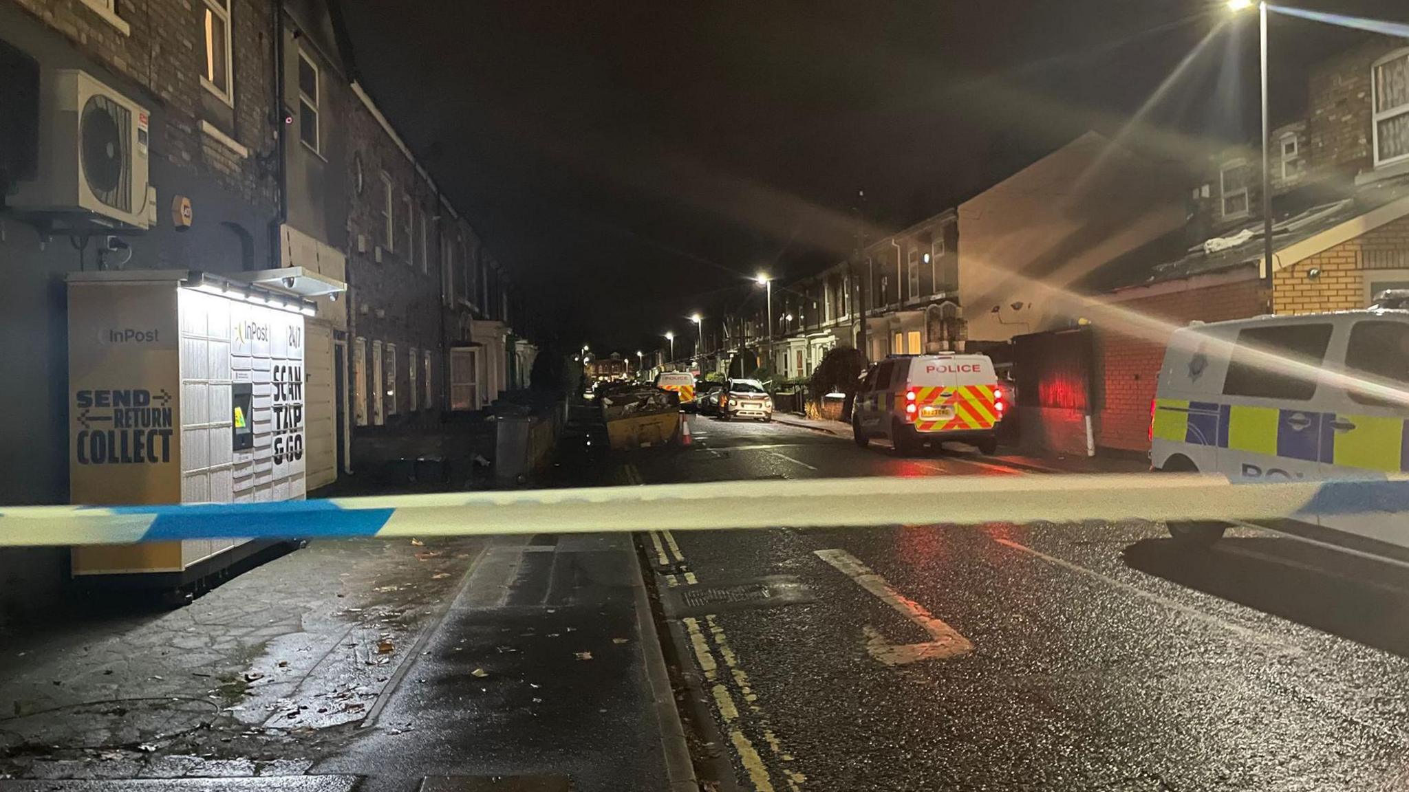 Police cordon in a dark street