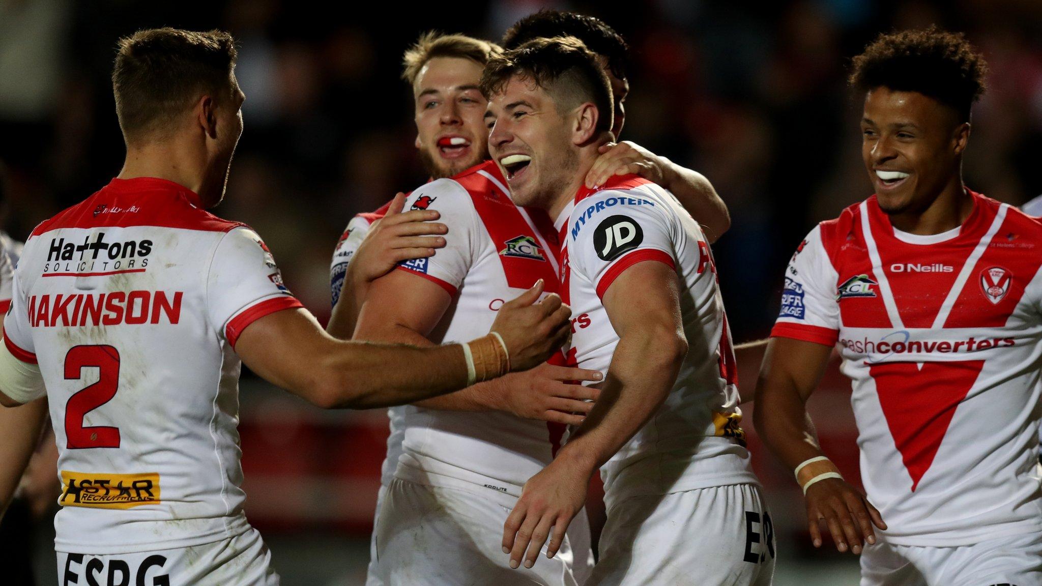 St Helens players celebrate Mark Percival scoring their fourth try against Hull FC