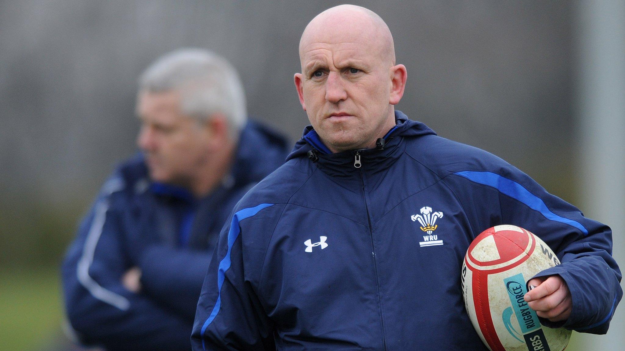 Shaun Edwards (foreground) and Warren Gatland watch Wales train