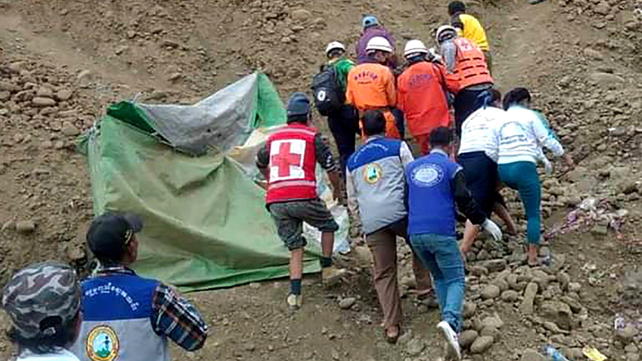 Myanmar emergency services conduct a search and rescue operation after an accident at a jade mining site in Hpakant, Kachin State, northern Myanmar, 22 December 2021