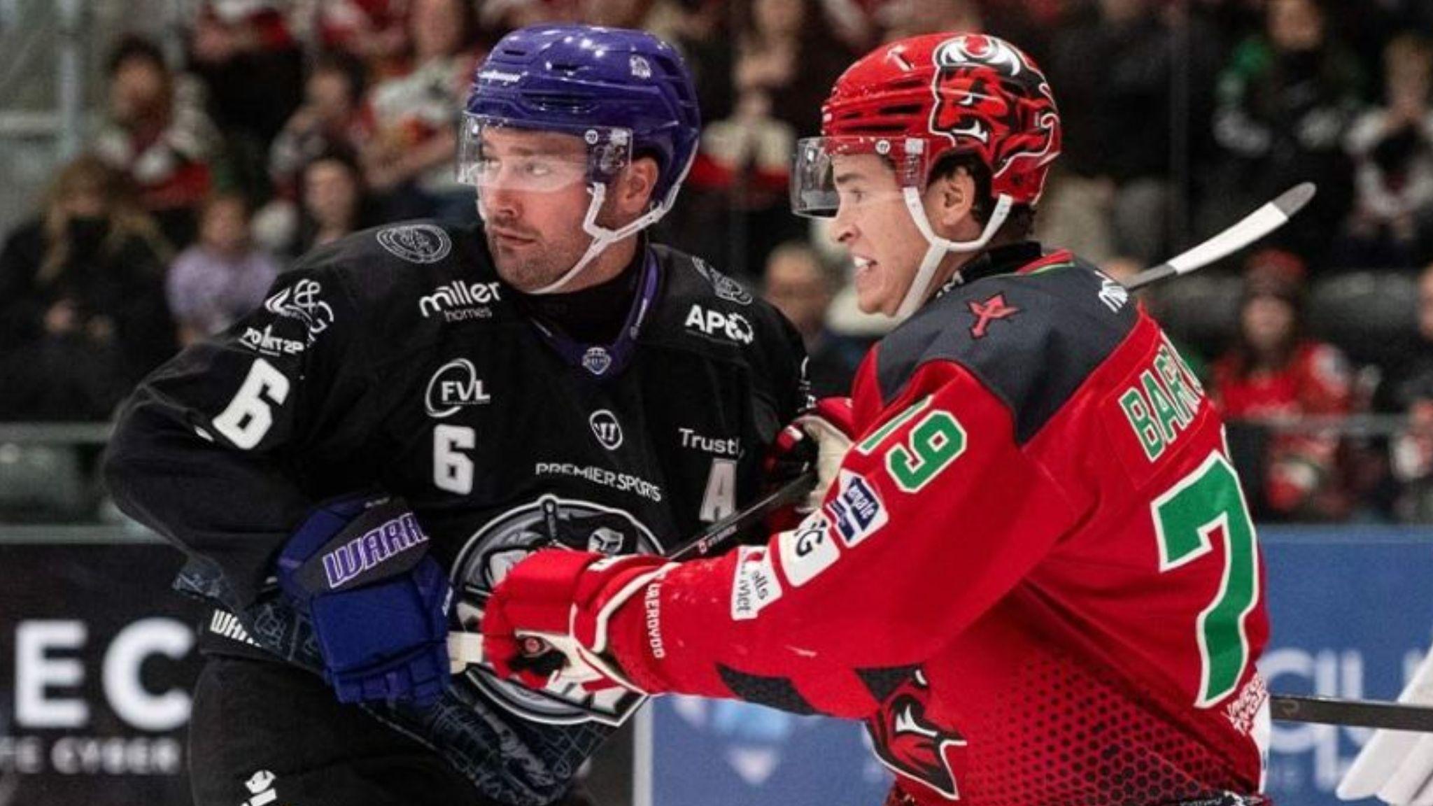 Glasgow Clan's Colton Poolman (left) and Cardiff Devils' Ryan Barrow tussle at Vindico Arena