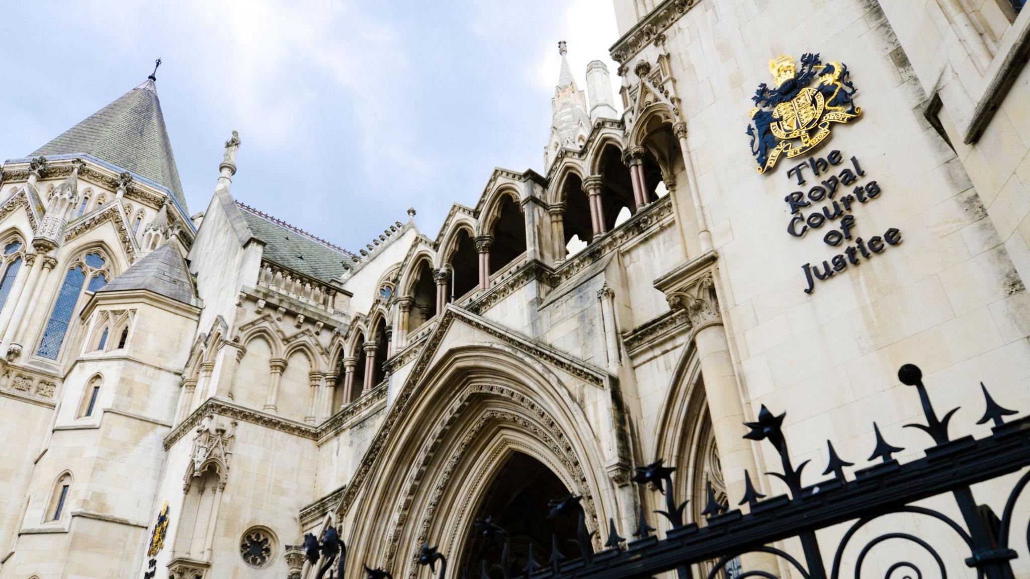 Facade of the Royal Courts of Justice along the Strand in the City of Westminster in London, England