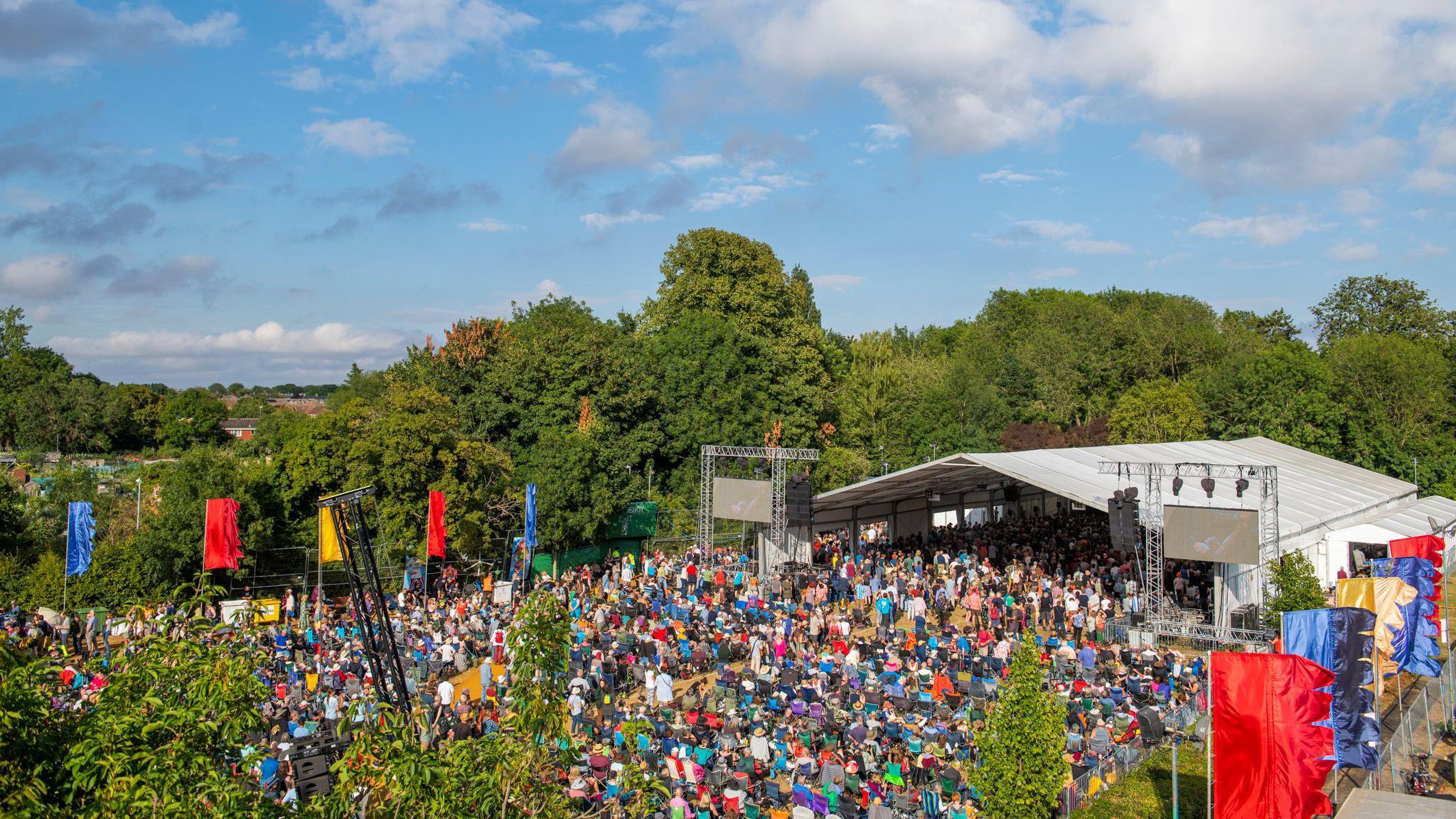 An elevated view of Cambridge Folk Festival Stage one full of people