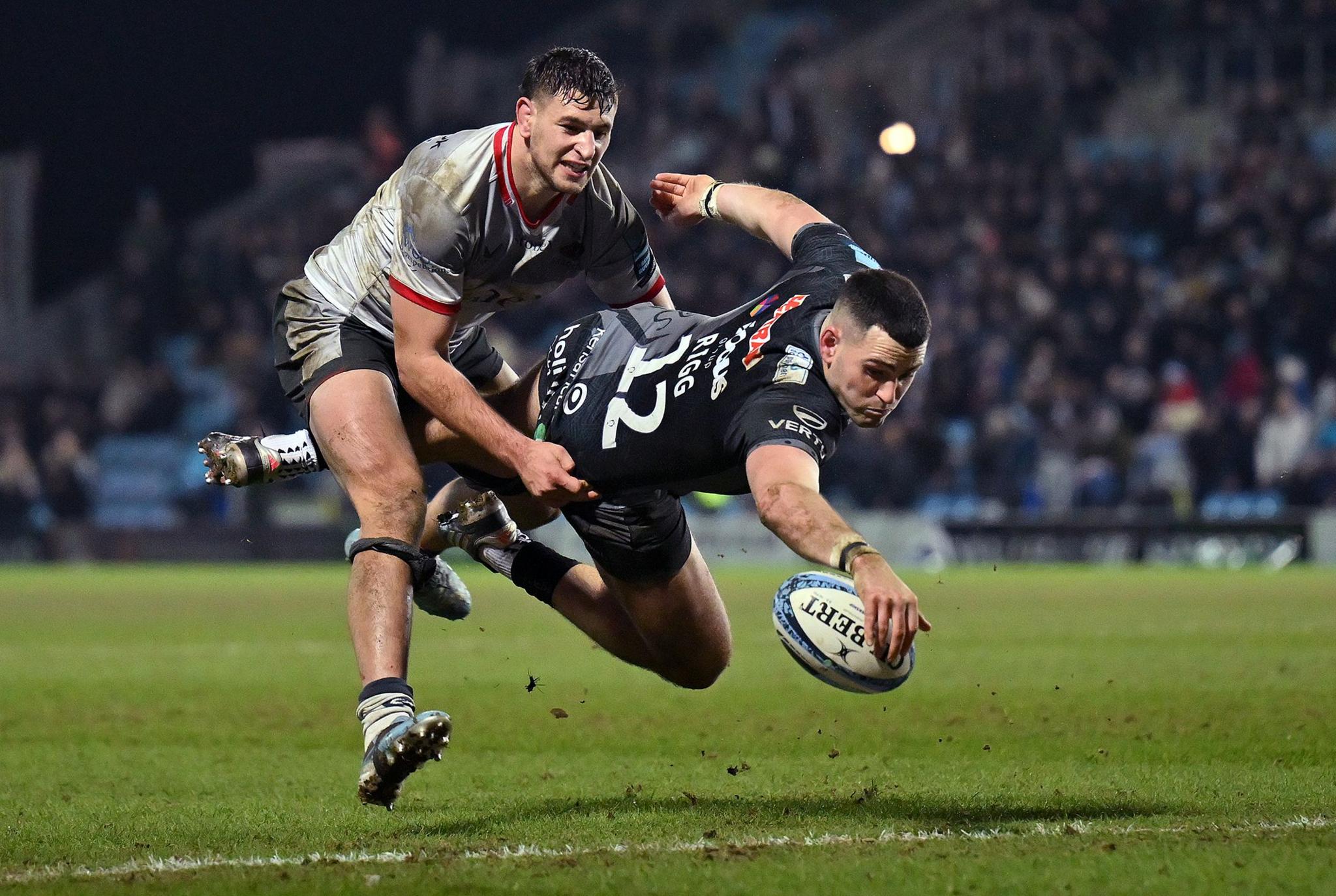 Will Rigg of Exeter Chiefs scores his side's second try as he is tackled by Juan Martin Gonzalez of Saracens during the Gallagher Premiership Rugby match between Exeter Chiefs and Saracens at Sandy Park