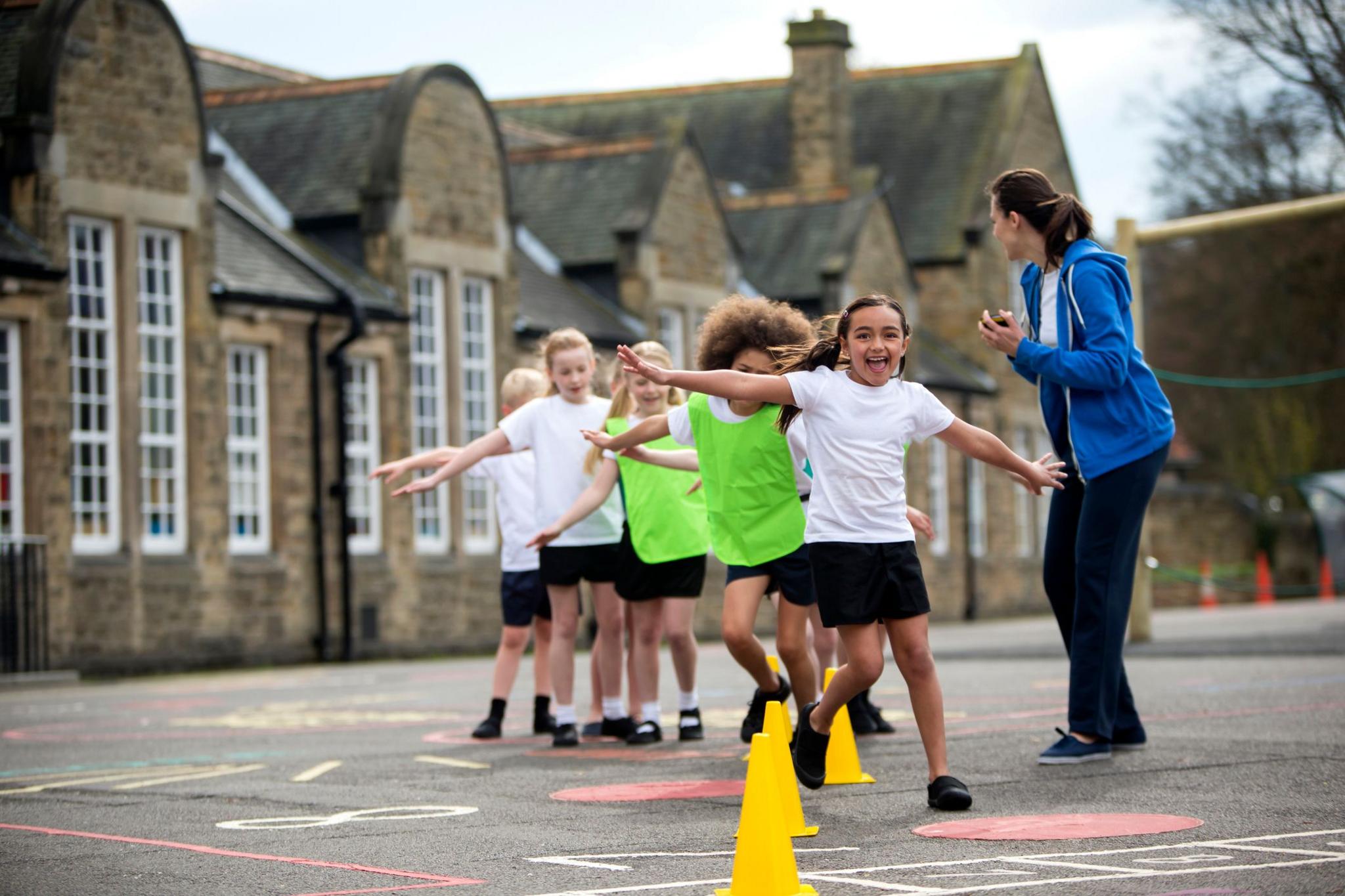 children doing PE outside. 